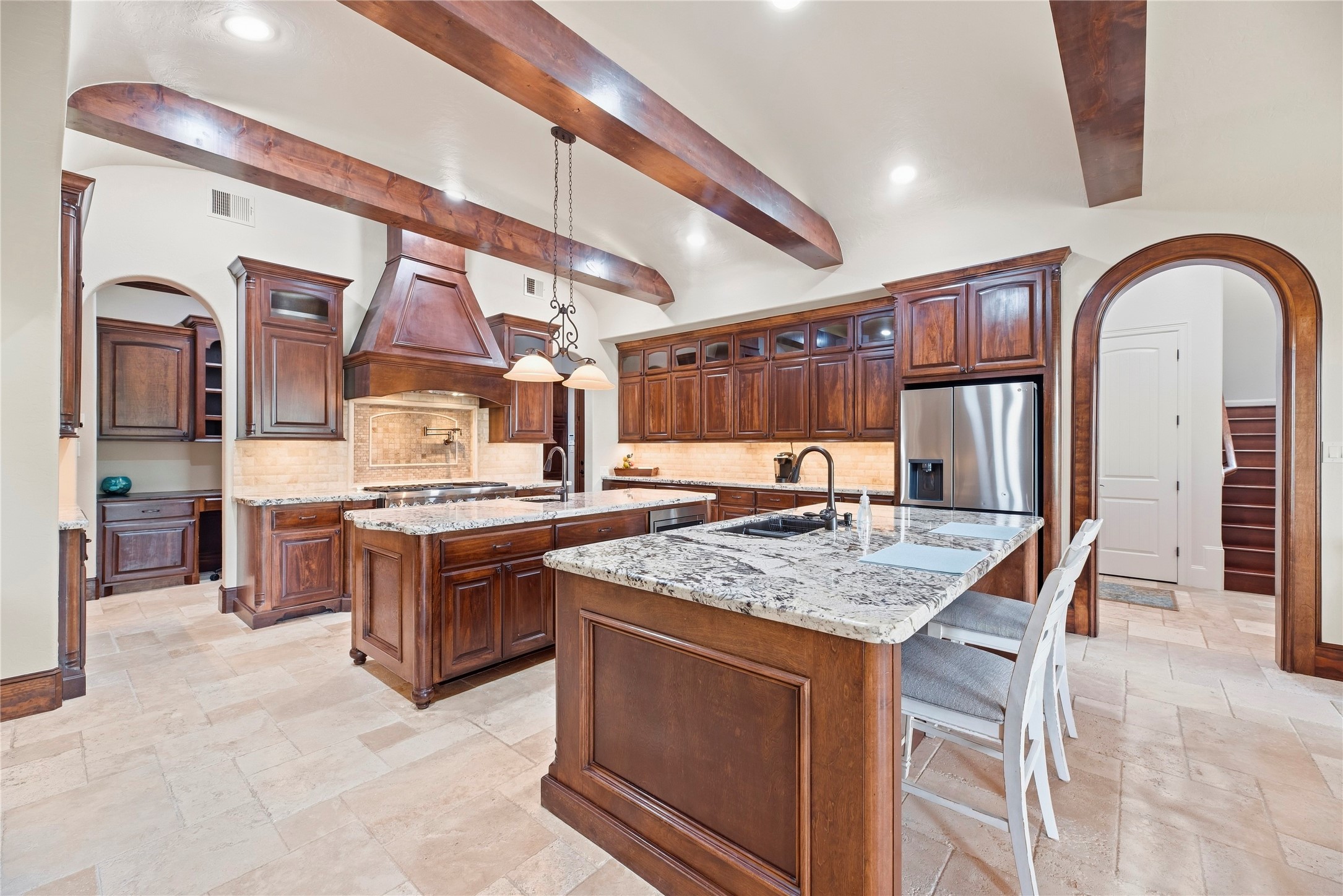 Two islands accommodates all the food for entertaining guest