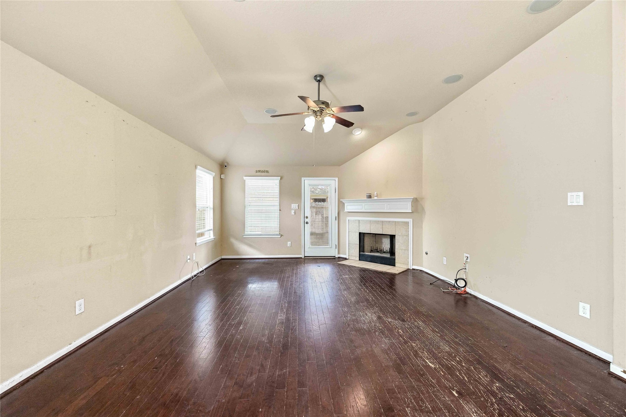 Generously sized living room with direct access to the backyard.