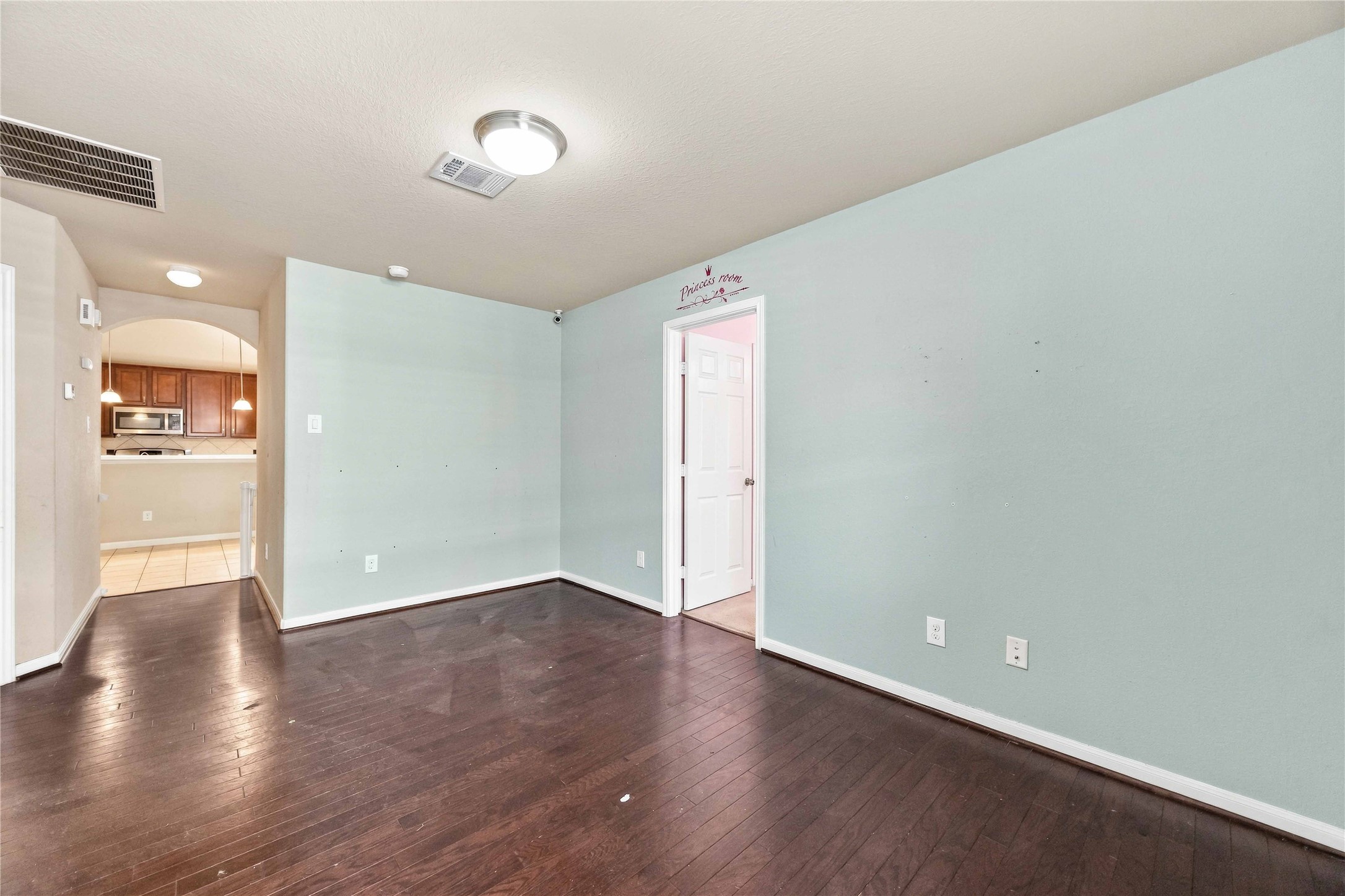 Easy access to the kitchen, ideal for an office, playroom, or additional living area.
