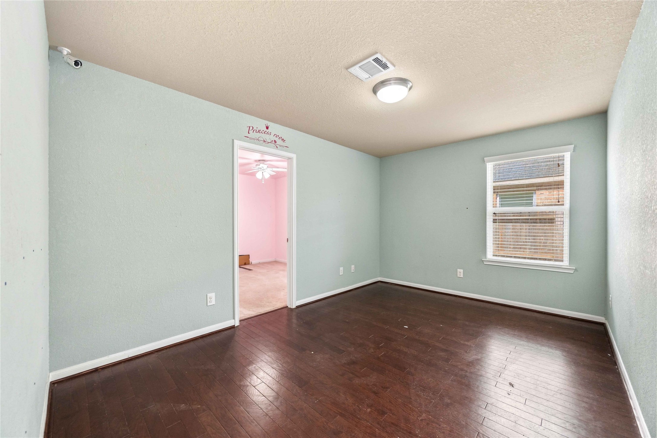 Versatile flex space ideal for a home office, playroom, or additional living area.