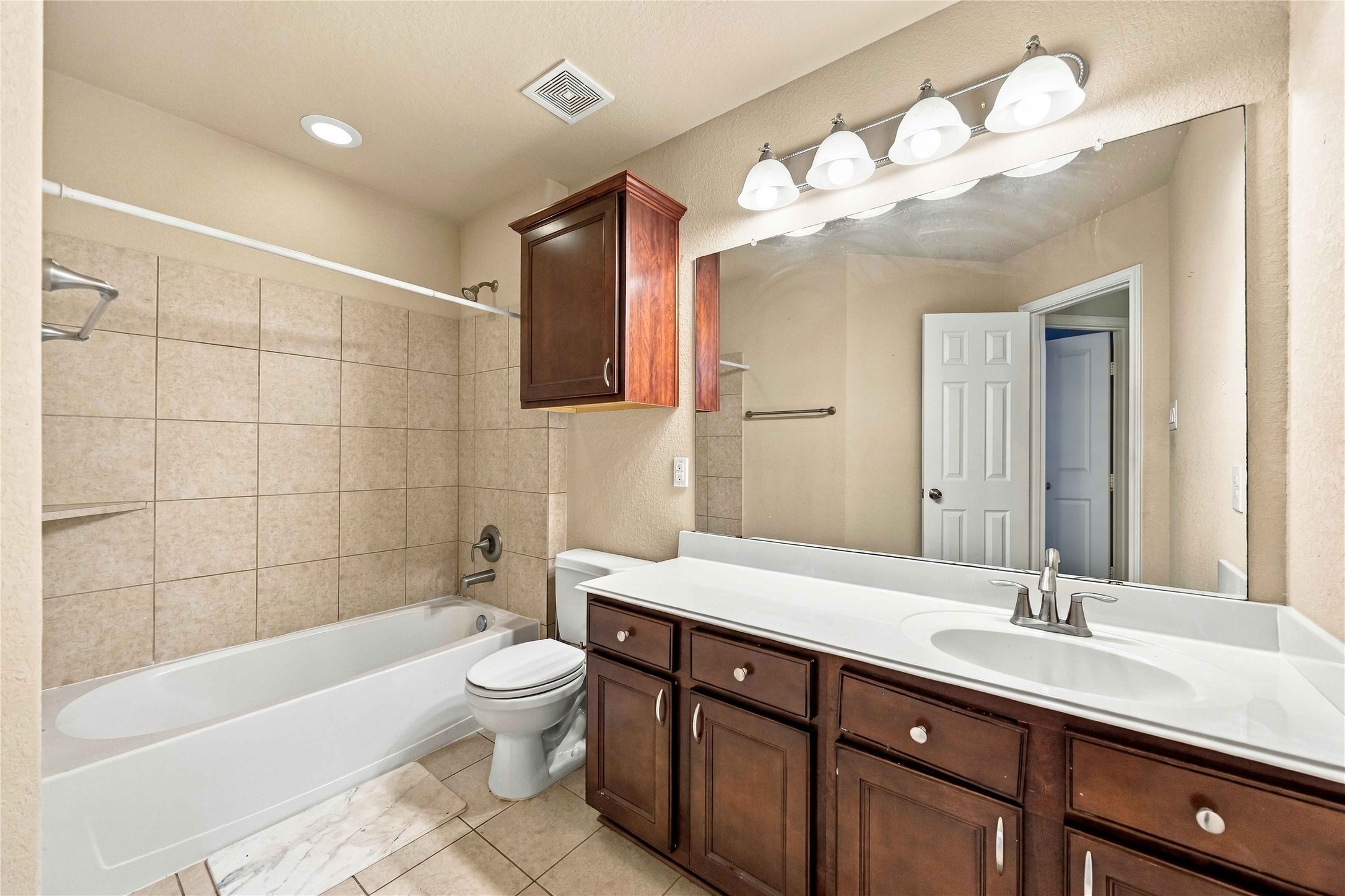 25
Secondary bath features an extended vanity with generous counter space.