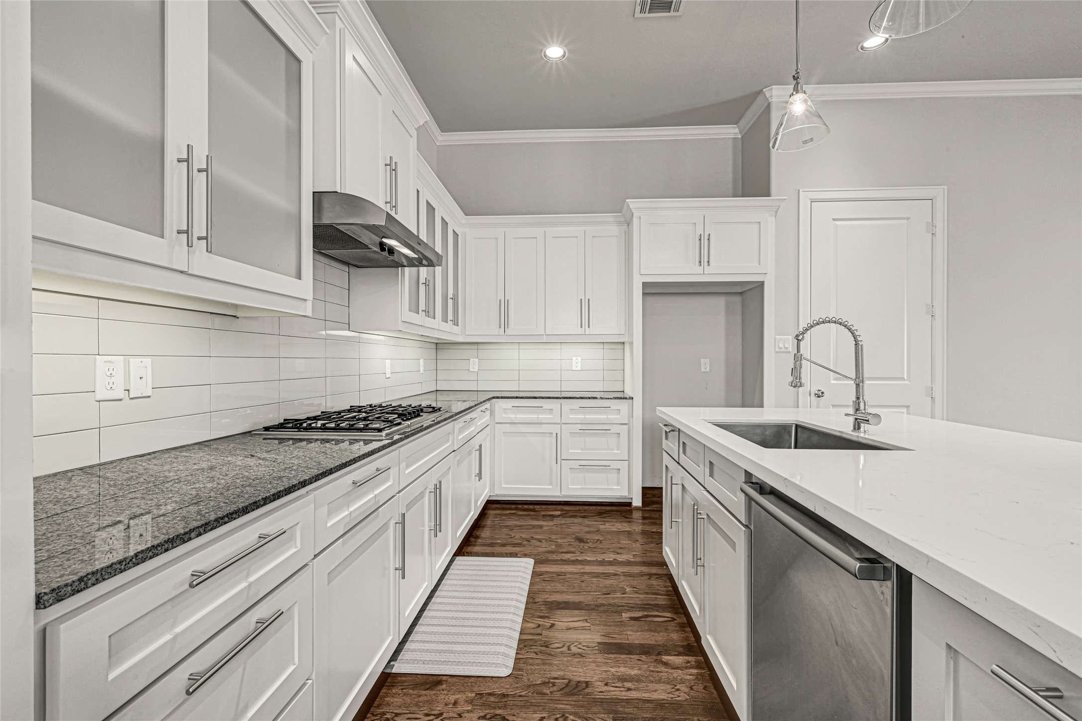 Granite and Quartz countertops with elegant & timeless white cabinets