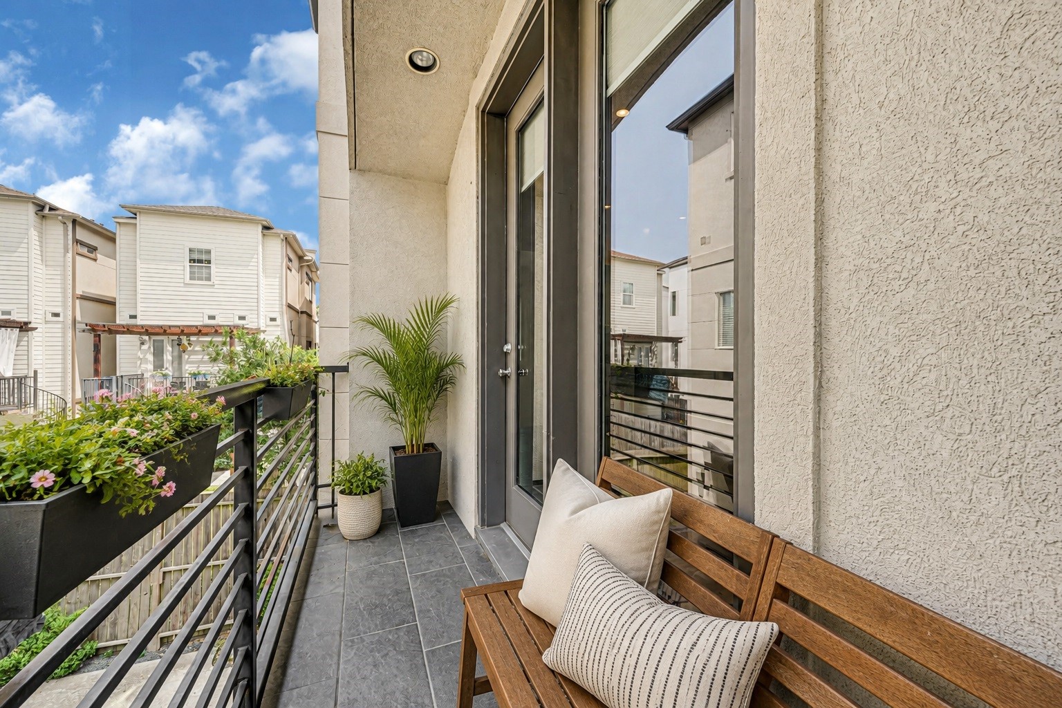 Enjoy the beautiful balcony, perfect for lounging or grilling -Virtually staged