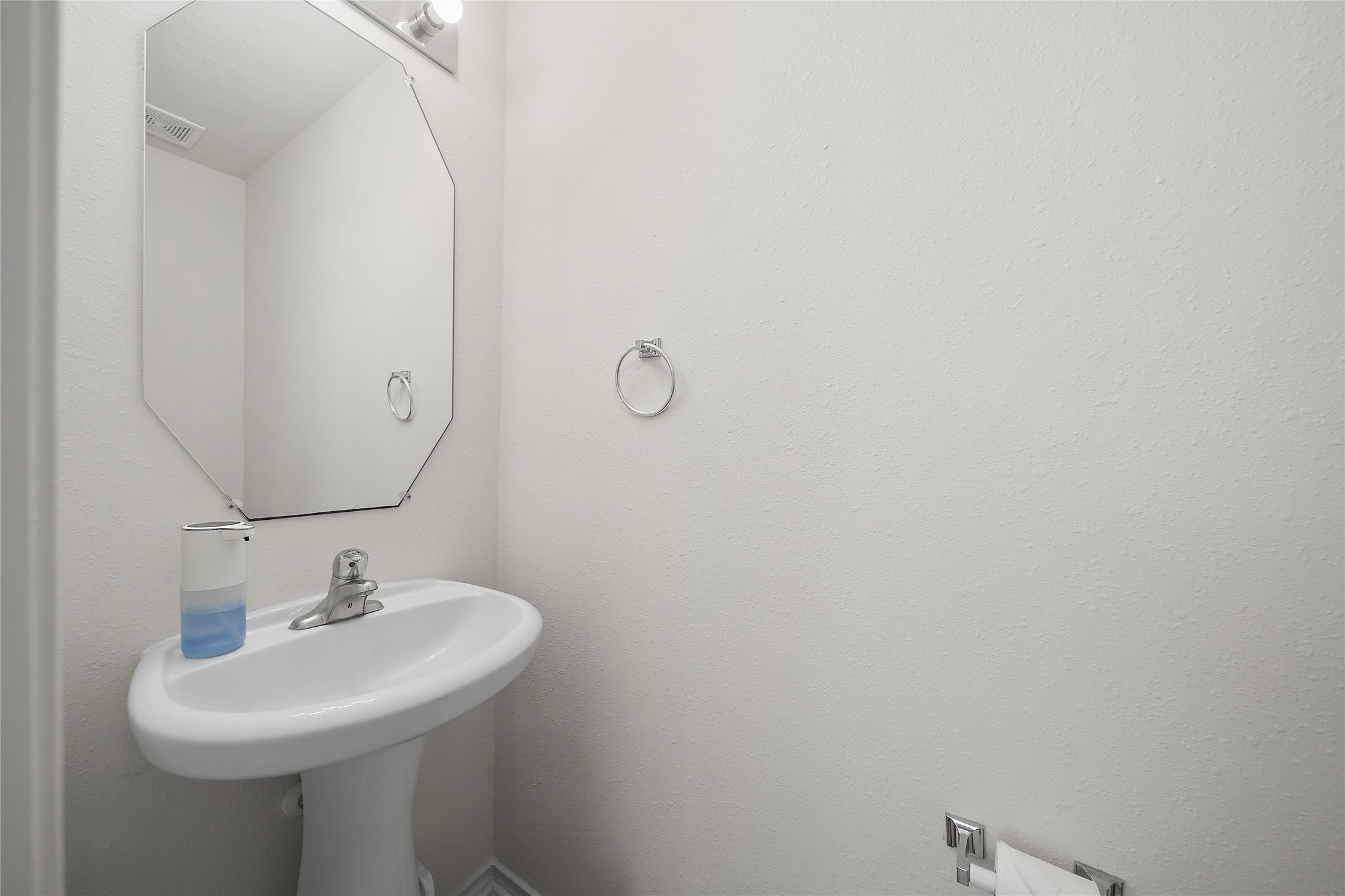 Convenient downstairs half bath for guests.