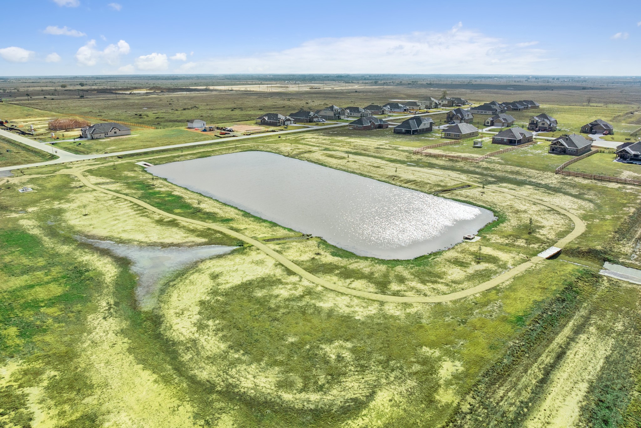 The sparkling community pond provides a scenic centerpiece for the neighborhood, featuring walking trails perfect for your daily stroll or morning run
