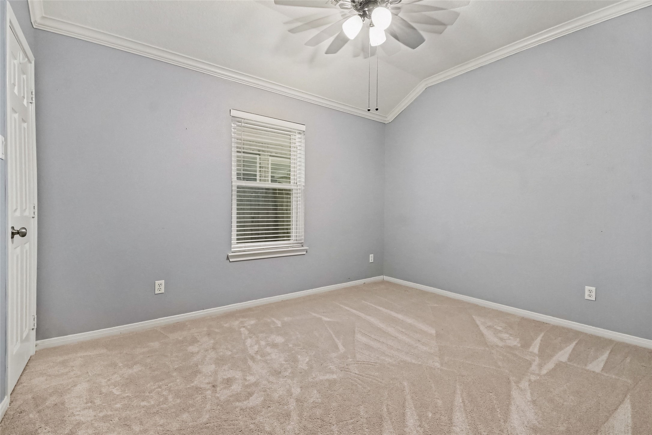 2nd bedroom has crown molding and plush carpeting like the other bedrooms