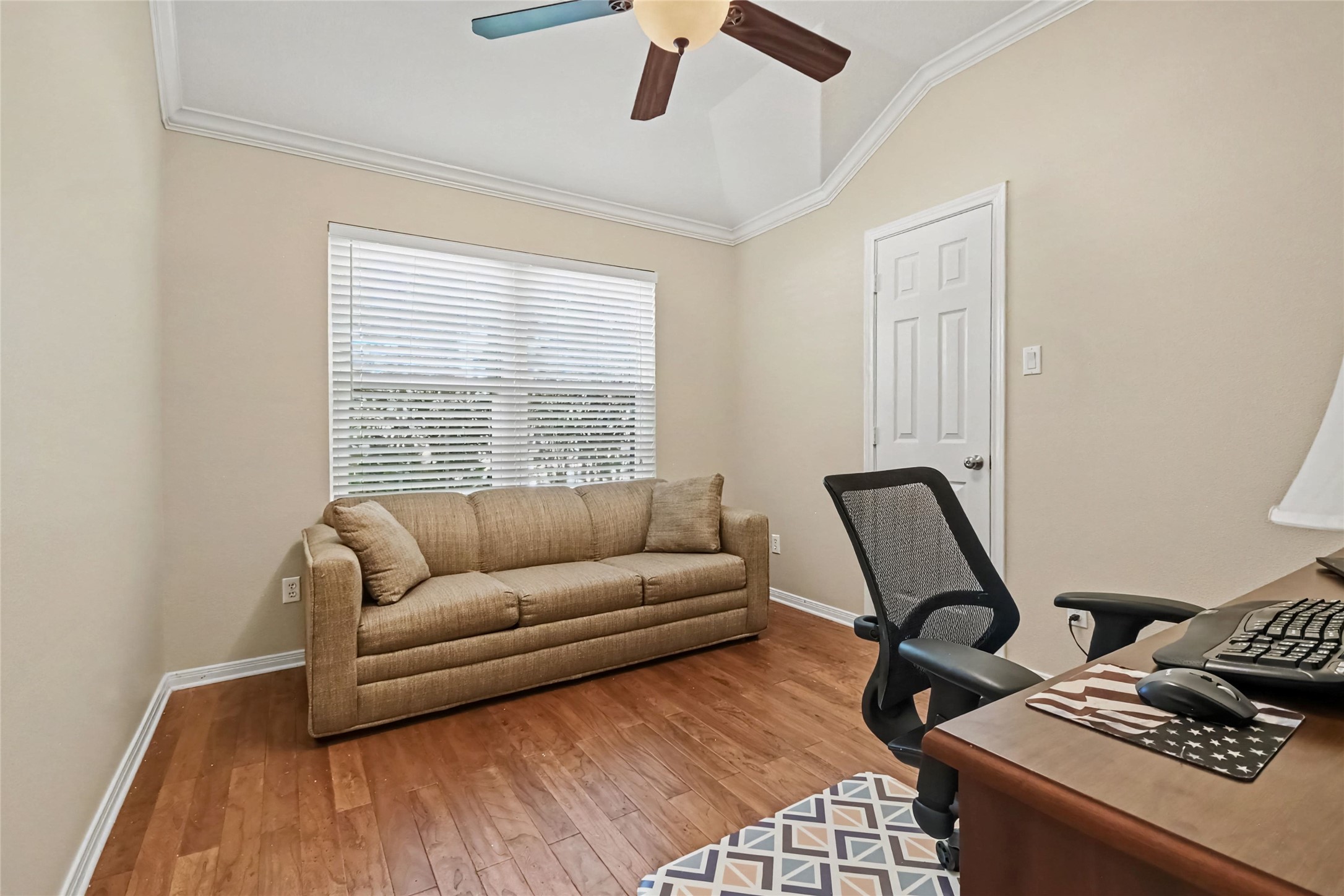3rd bedroom being used as a home office, wood floors