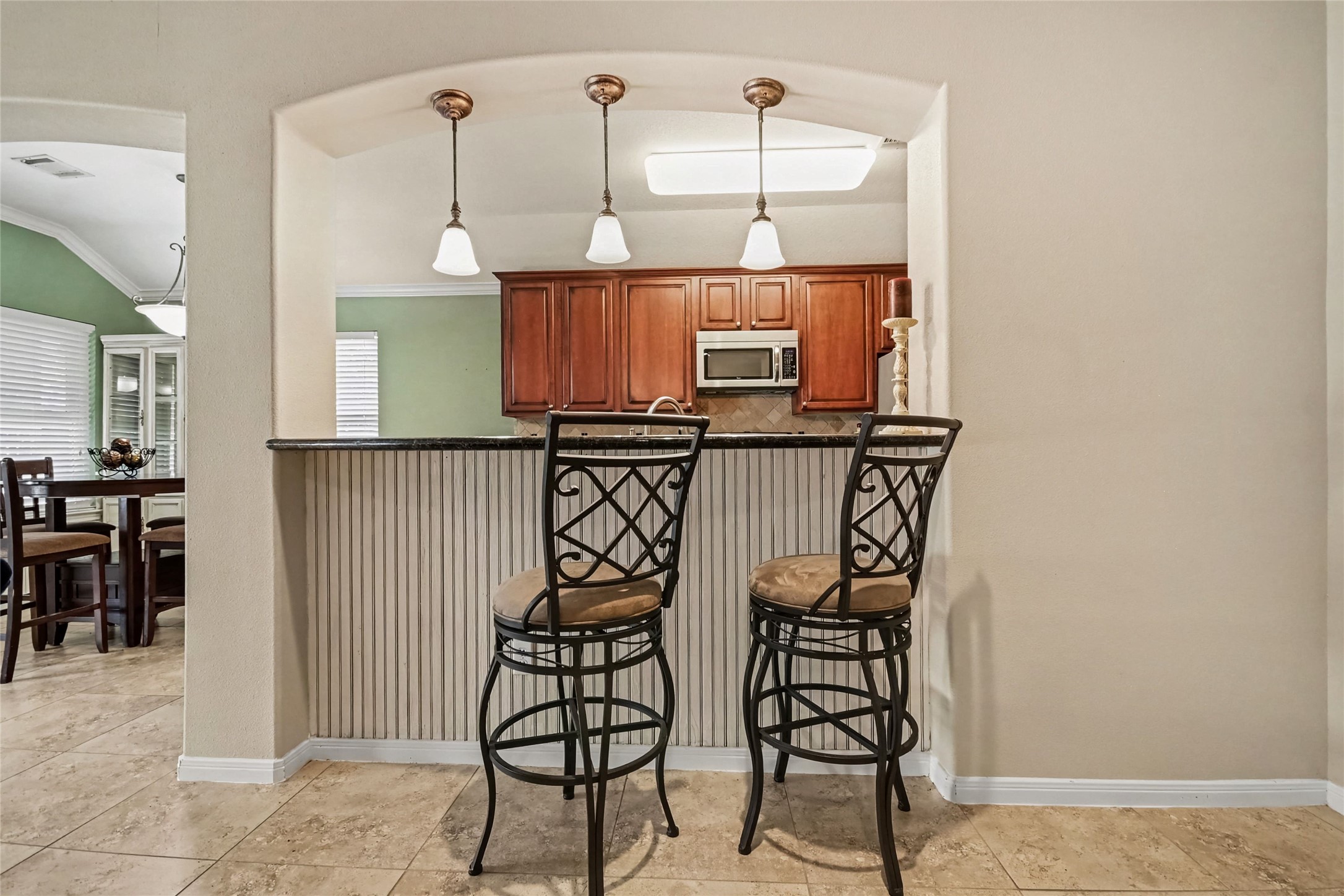 Attractive beadboard accents on the bar and that matches the dining cabinet and beadboard in dining area. Attractive beadboard accents on the bar and that matches the dining cabinet and beadboard in dining area.