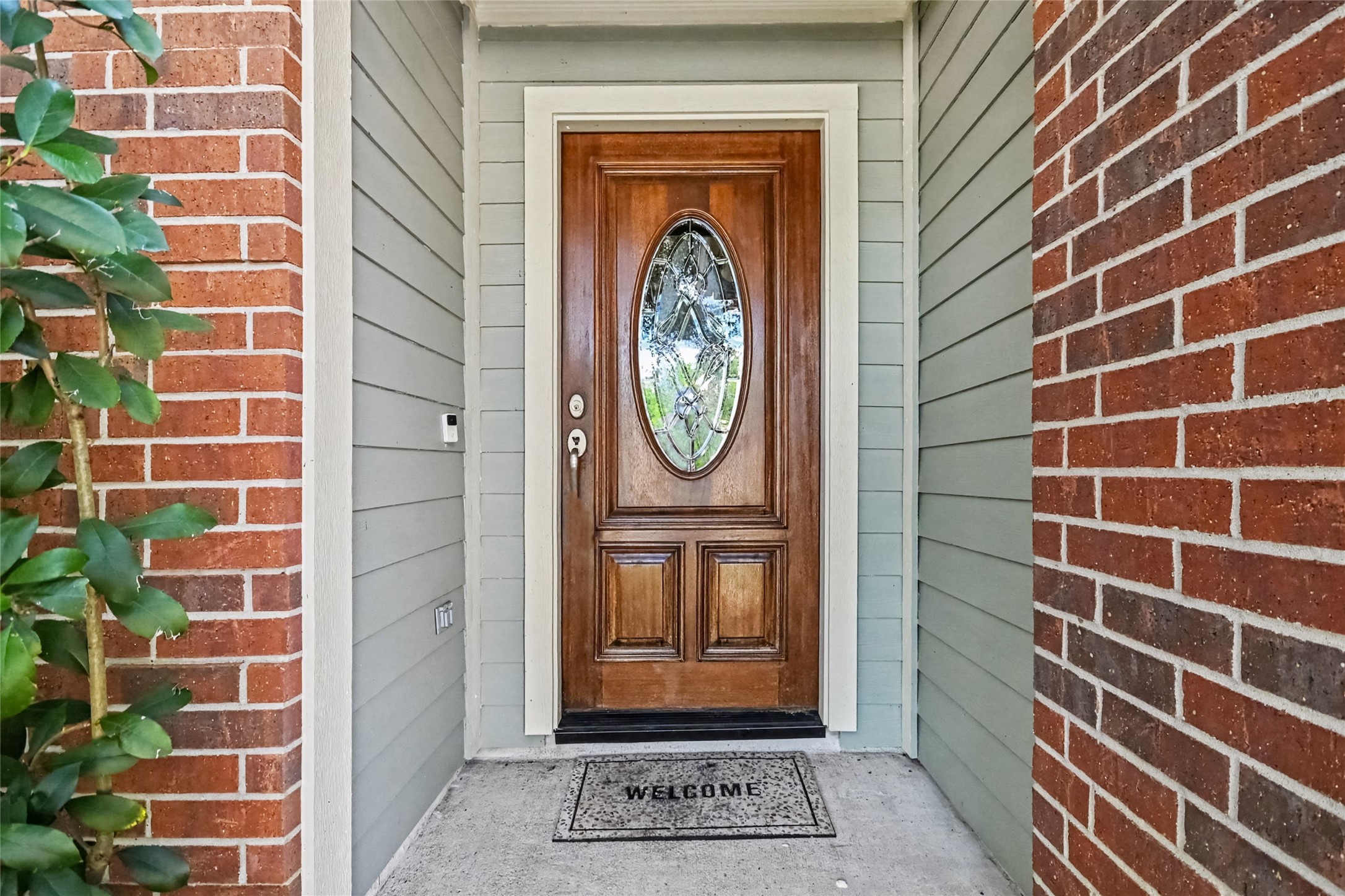 Beautiful leaded glass door, be sure to look up at the wood finished porch ceiling Beautiful leaded glass door, be sure to look up at the wood finished porch ceiling