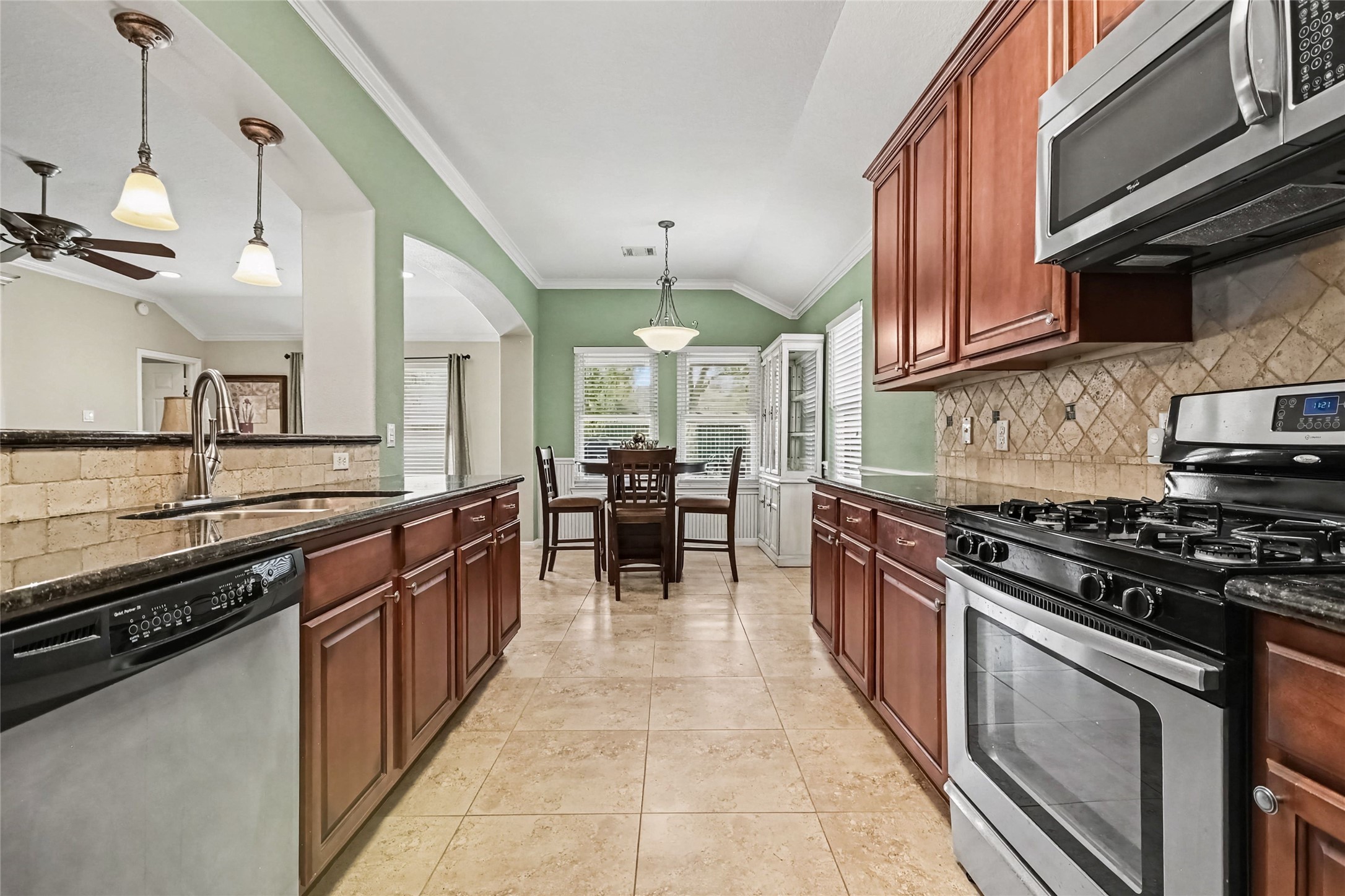 Notice the decorative stone backsplash and how well the colors all work together