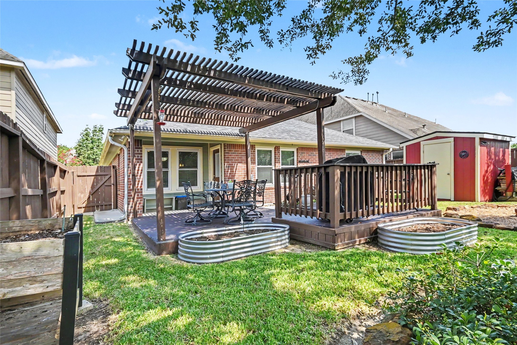 Notice the storage shed so you can keep the backyard tidy with a place for your lawn and gardening implements