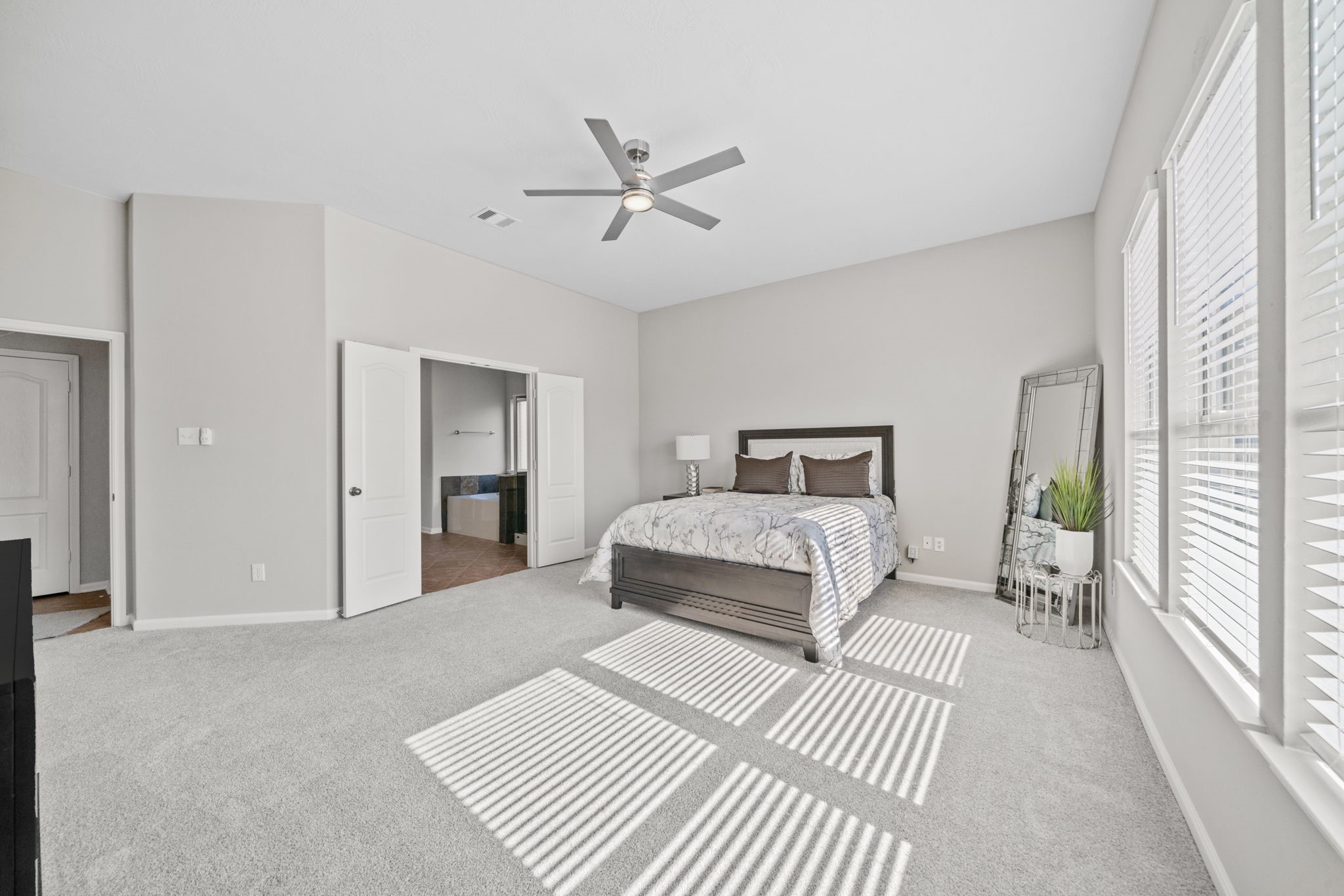 Primary suite filled with natural light and comfort.