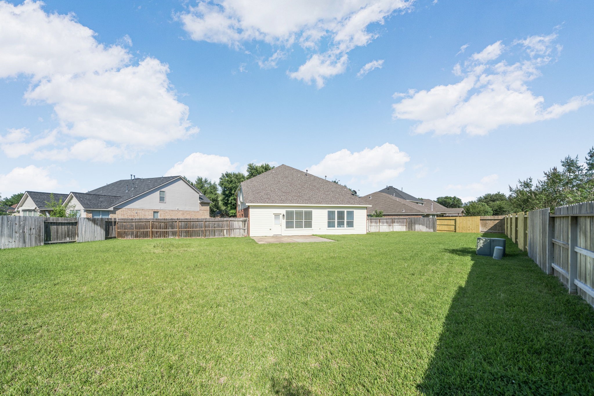 Huge backyard with endless possibilities for a pool, outdoor kitchen, or entertaining