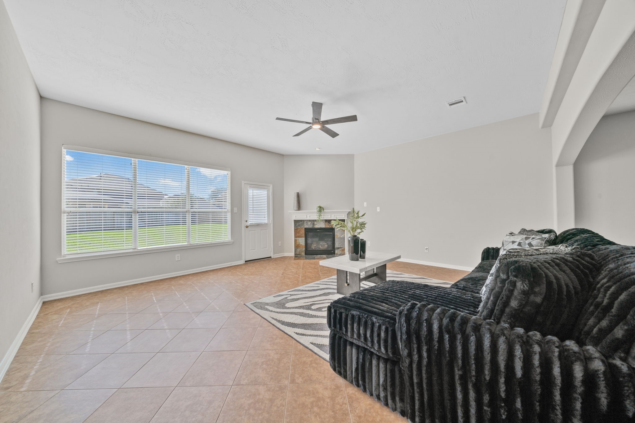 Bright family room overlooking the oversized backyard.