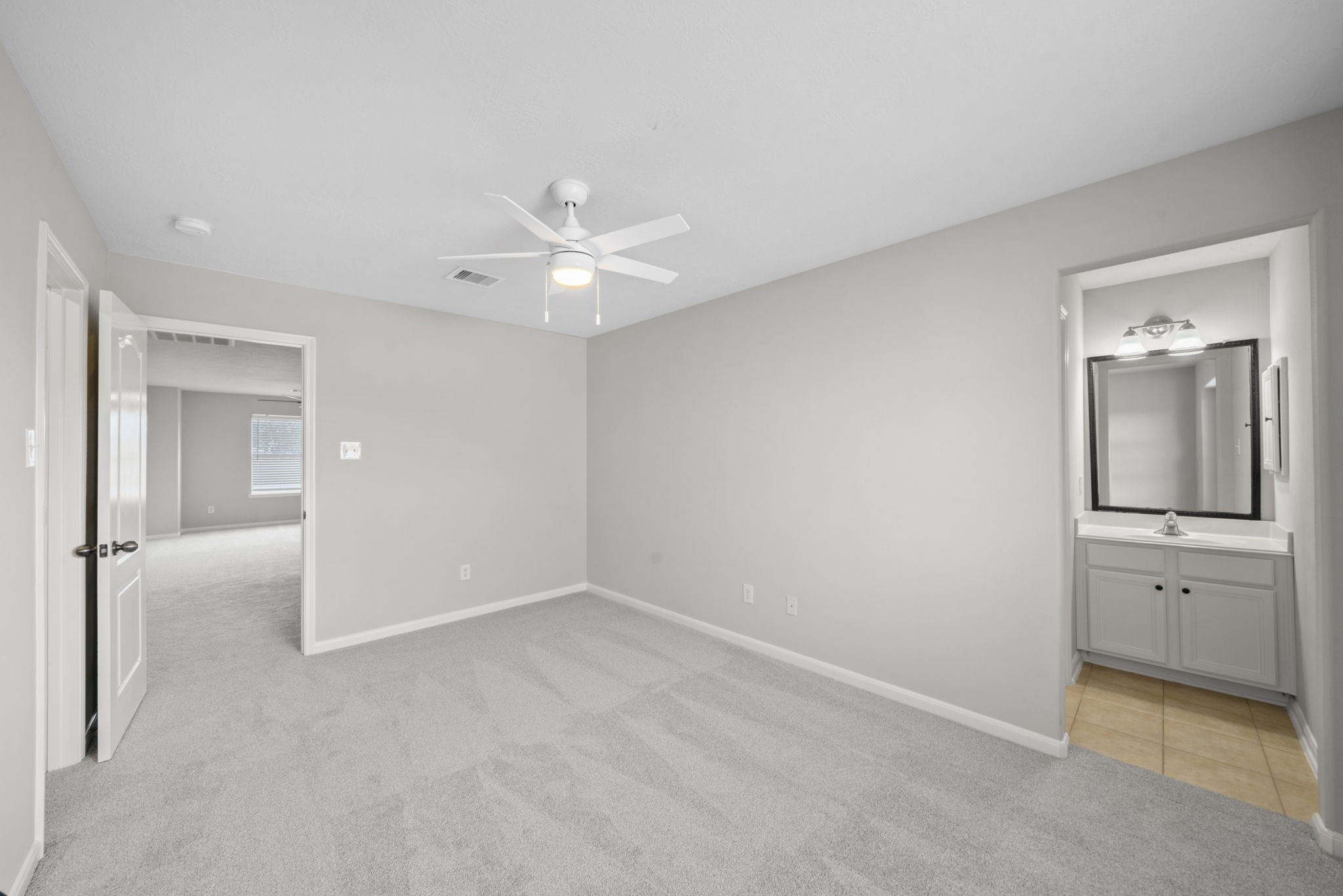 Large upstairs bedroom with generous space and storage.