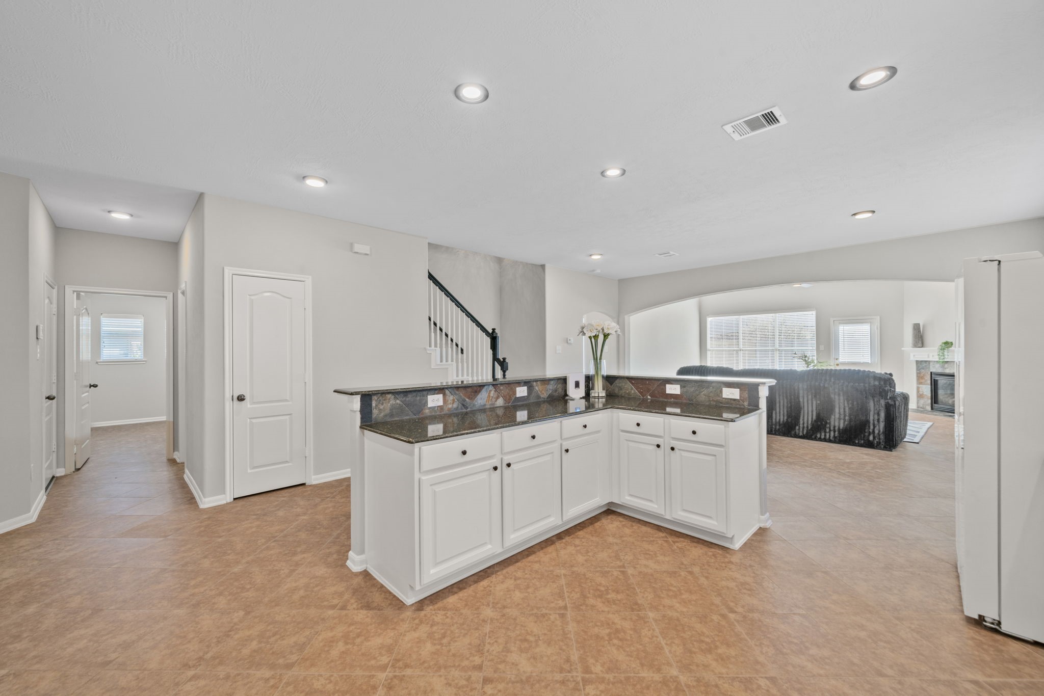 Open layout connecting kitchen and living spaces seamlessly.