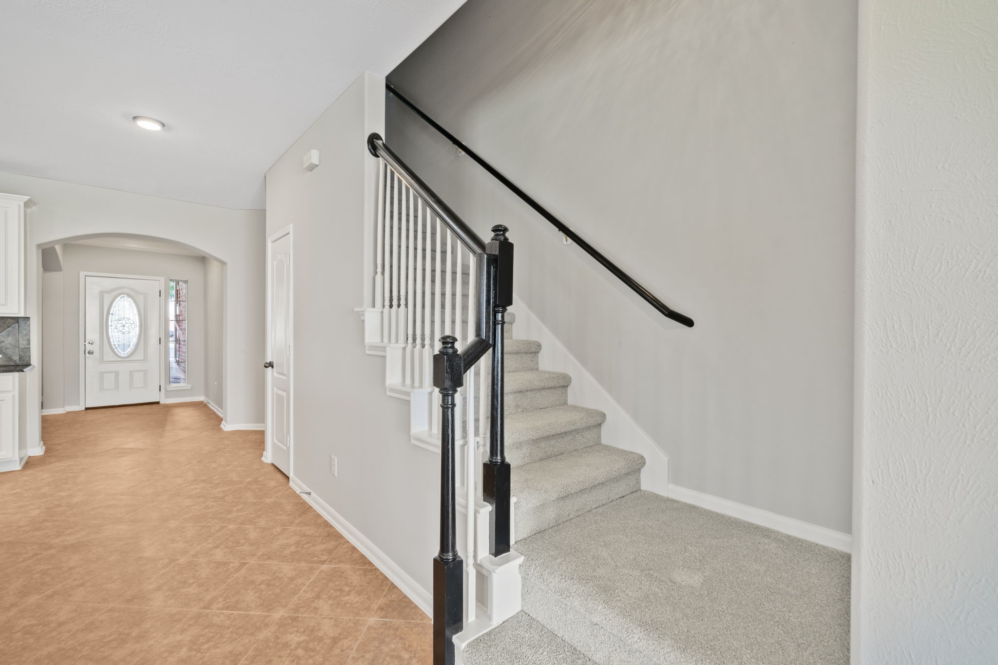 Elegant staircase and welcoming hallway entrance.
