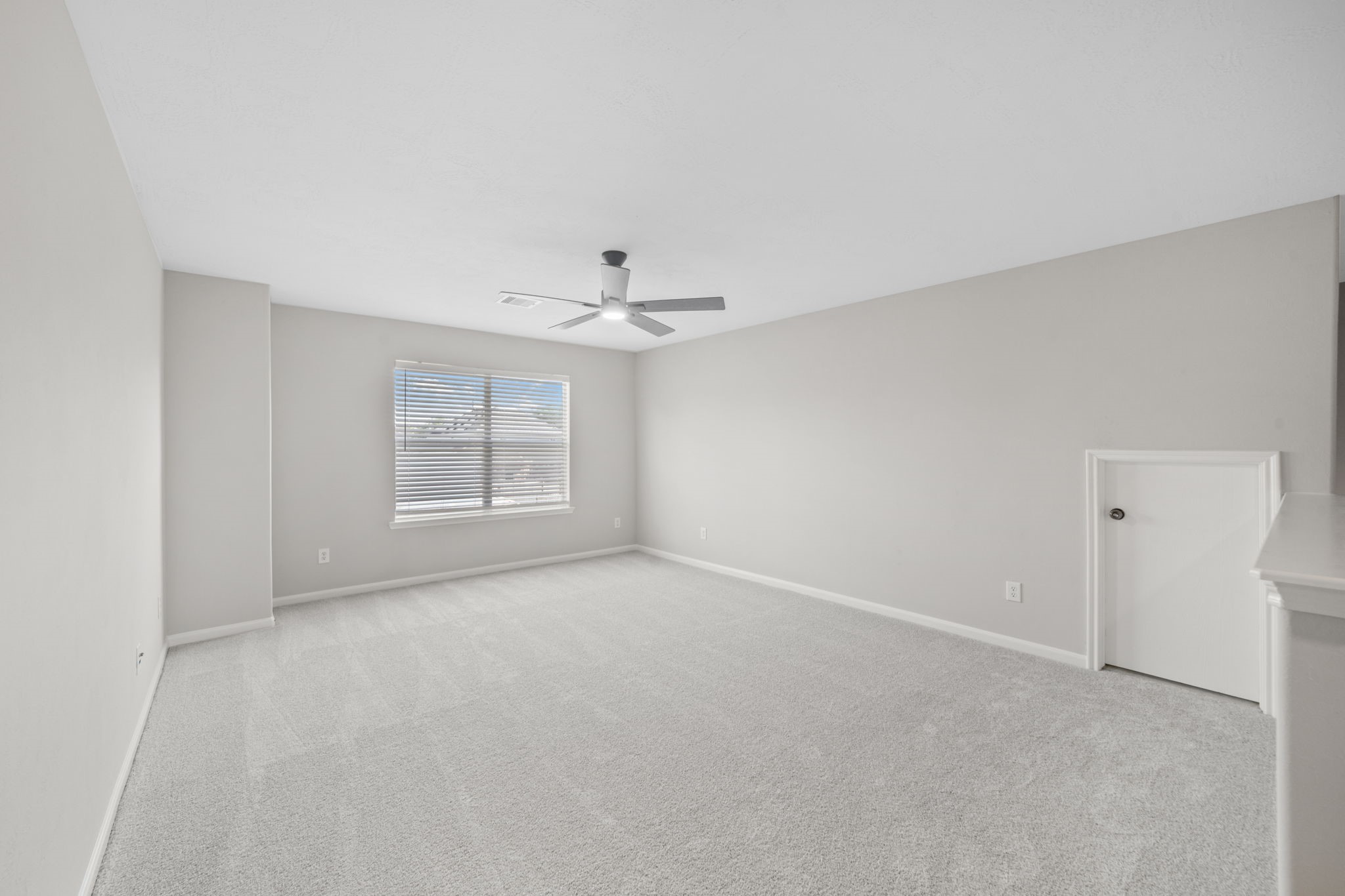 Flexible upstairs bonus room ideal for office, playroom, or media space.