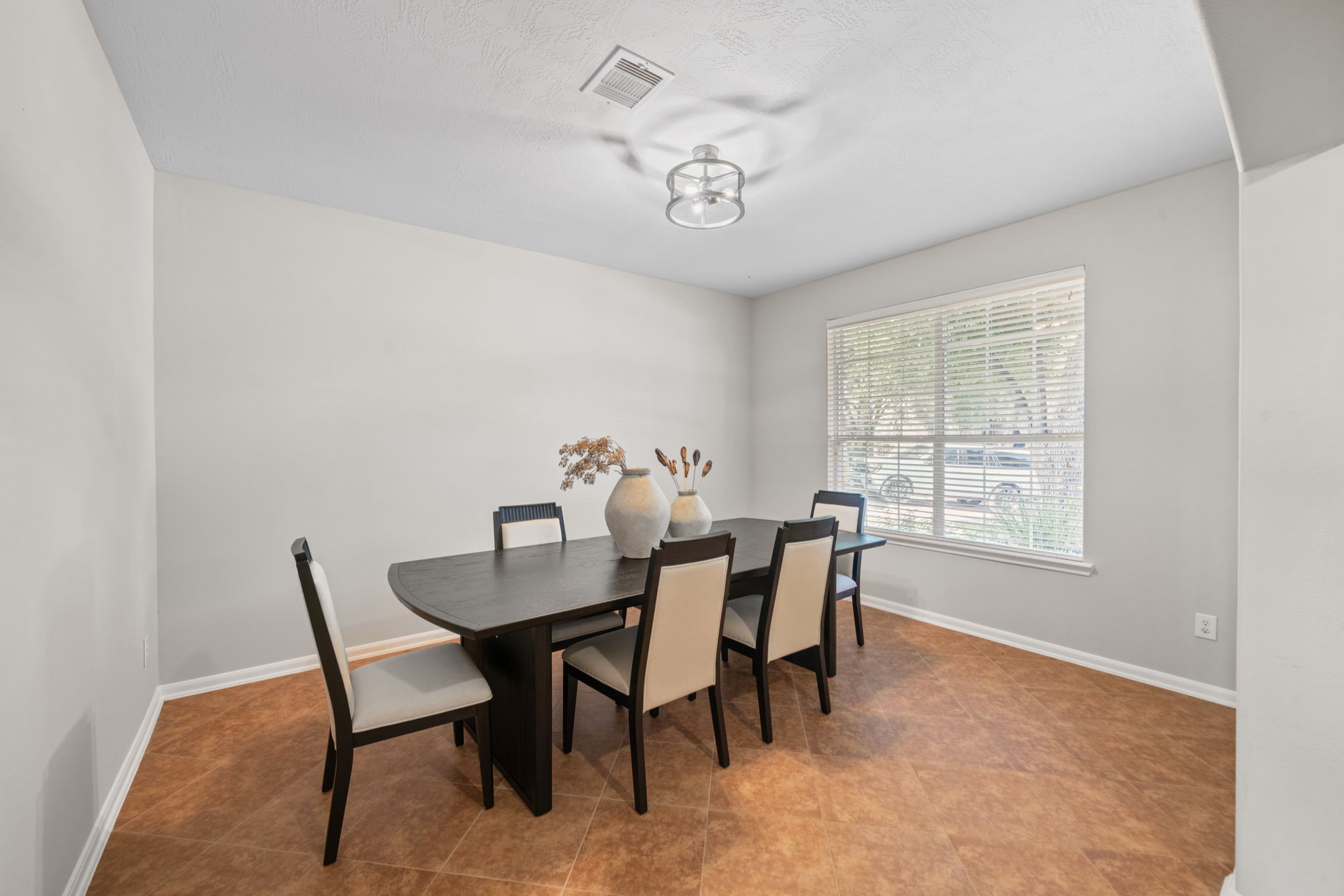 Spacious dining room with natural light.