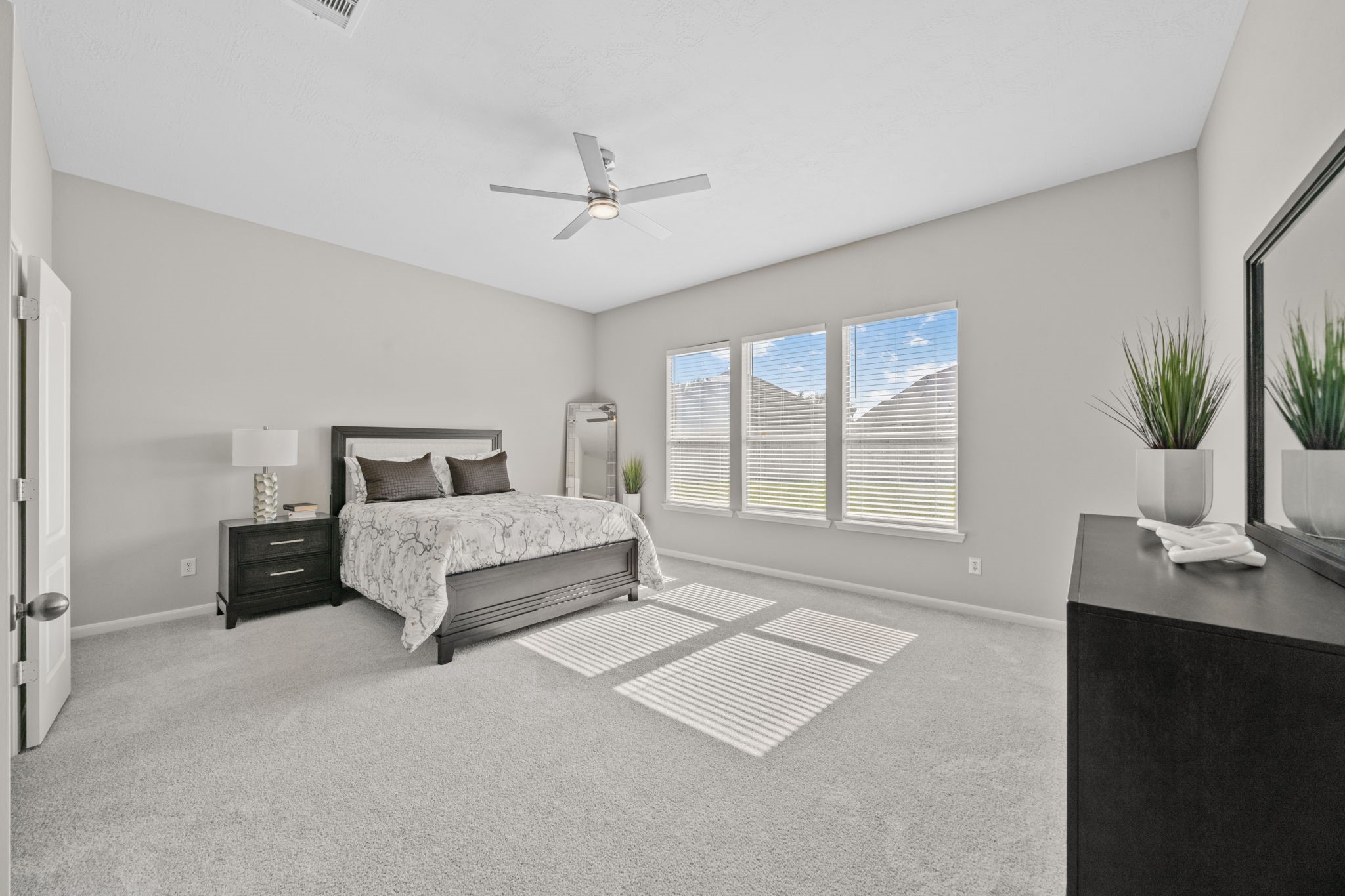 Spacious primary bedroom located on the first floor.