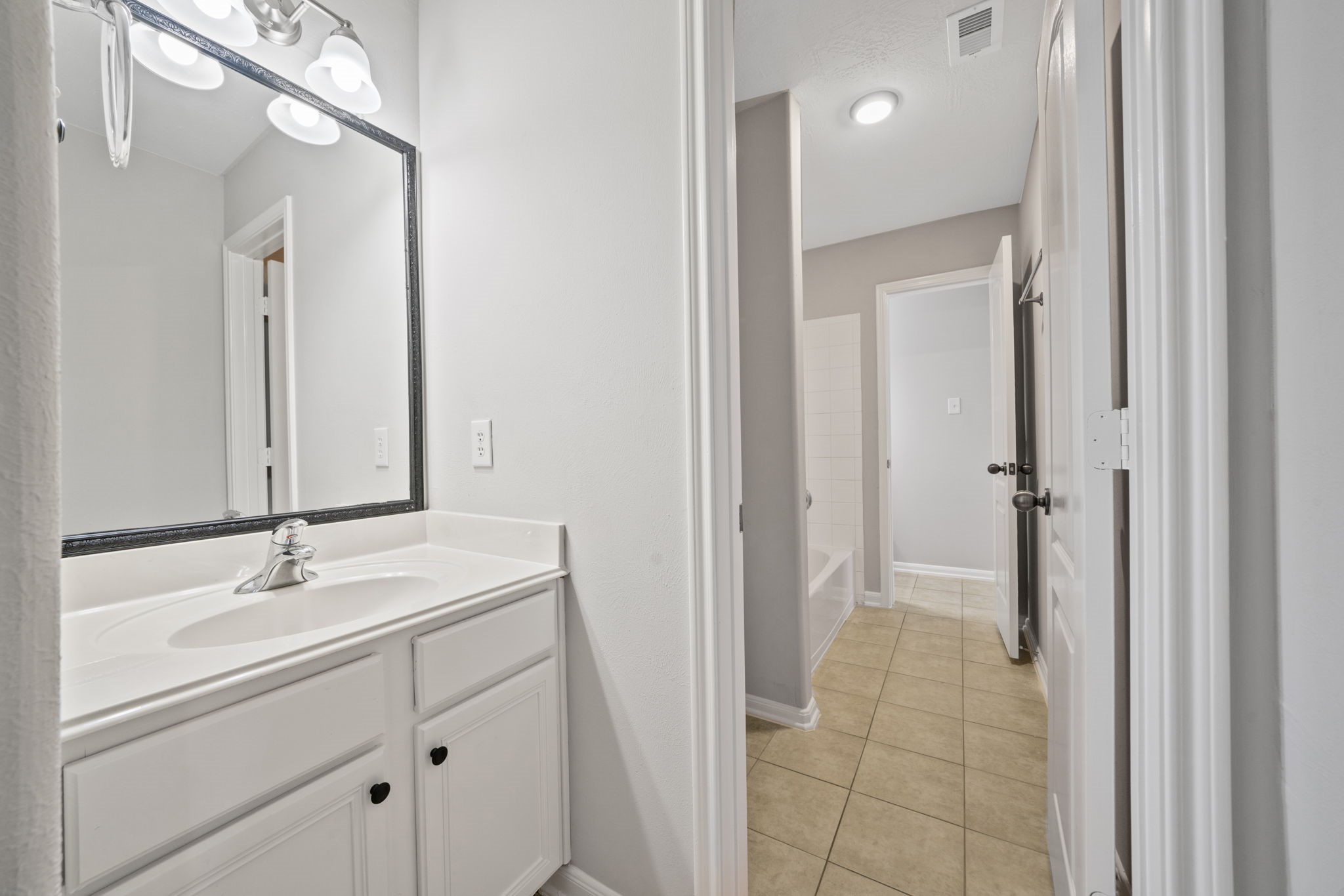 Additional vanity area in Hollywood-style bathroom.
