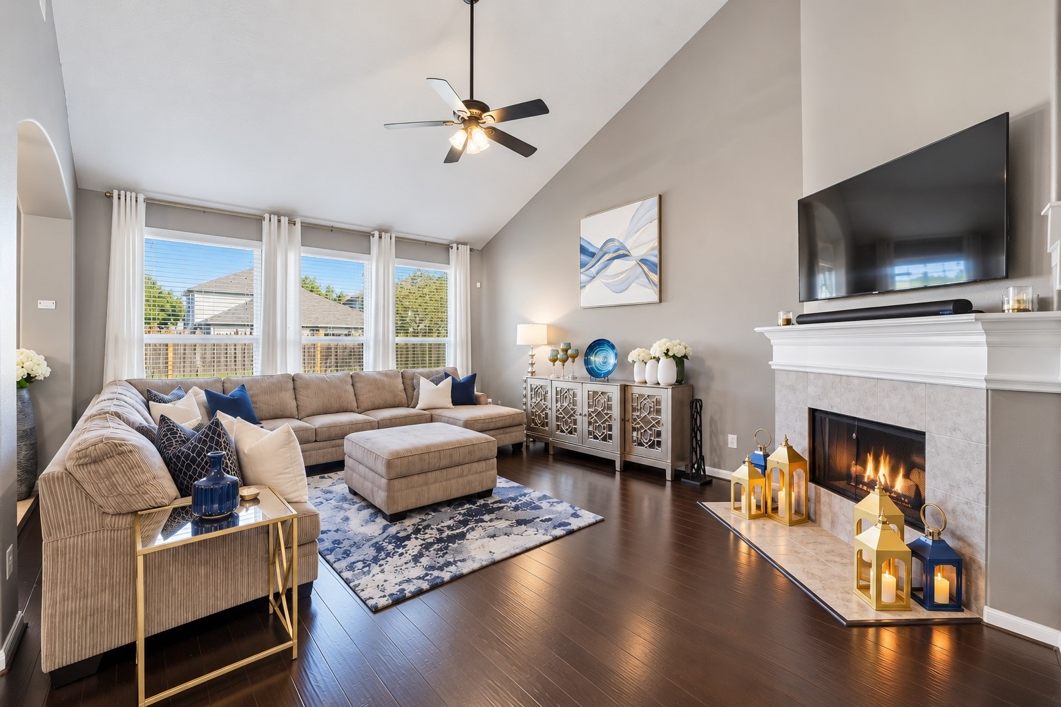 The warm family room is spacious, has tons of natural light and soaring ceilings. Nestle around the fireplace on those chilly fall nights. The warm family room is spacious, has tons of natural light and soaring ceilings. Nestle around the fireplace on those chilly fall nights.