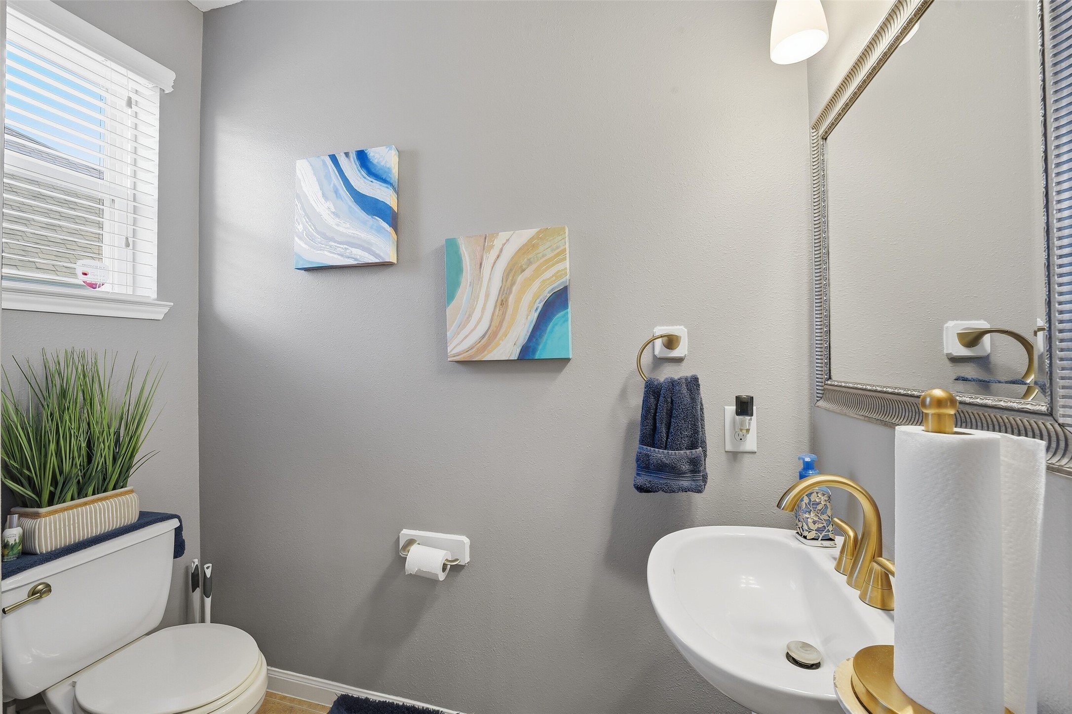 Downstairs is a spacious Half Bath, perfect for entertaining so guests don't have to go far. It also offers a storage closet that extends under the stairs.
