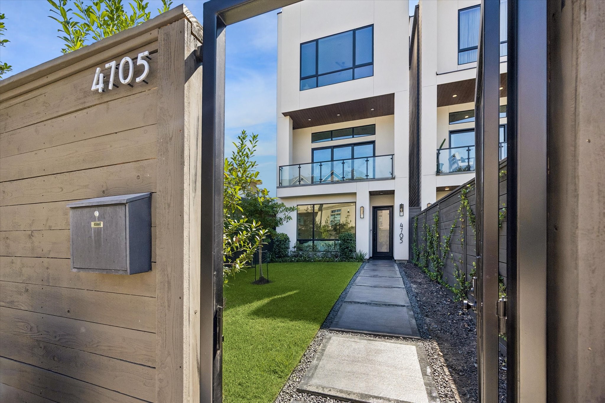 Tucked behind a fenced-in front entrance (ideal for private and security), you will be wowed upon your first arrival! Massive front yard space; ideal for pets/kids.
