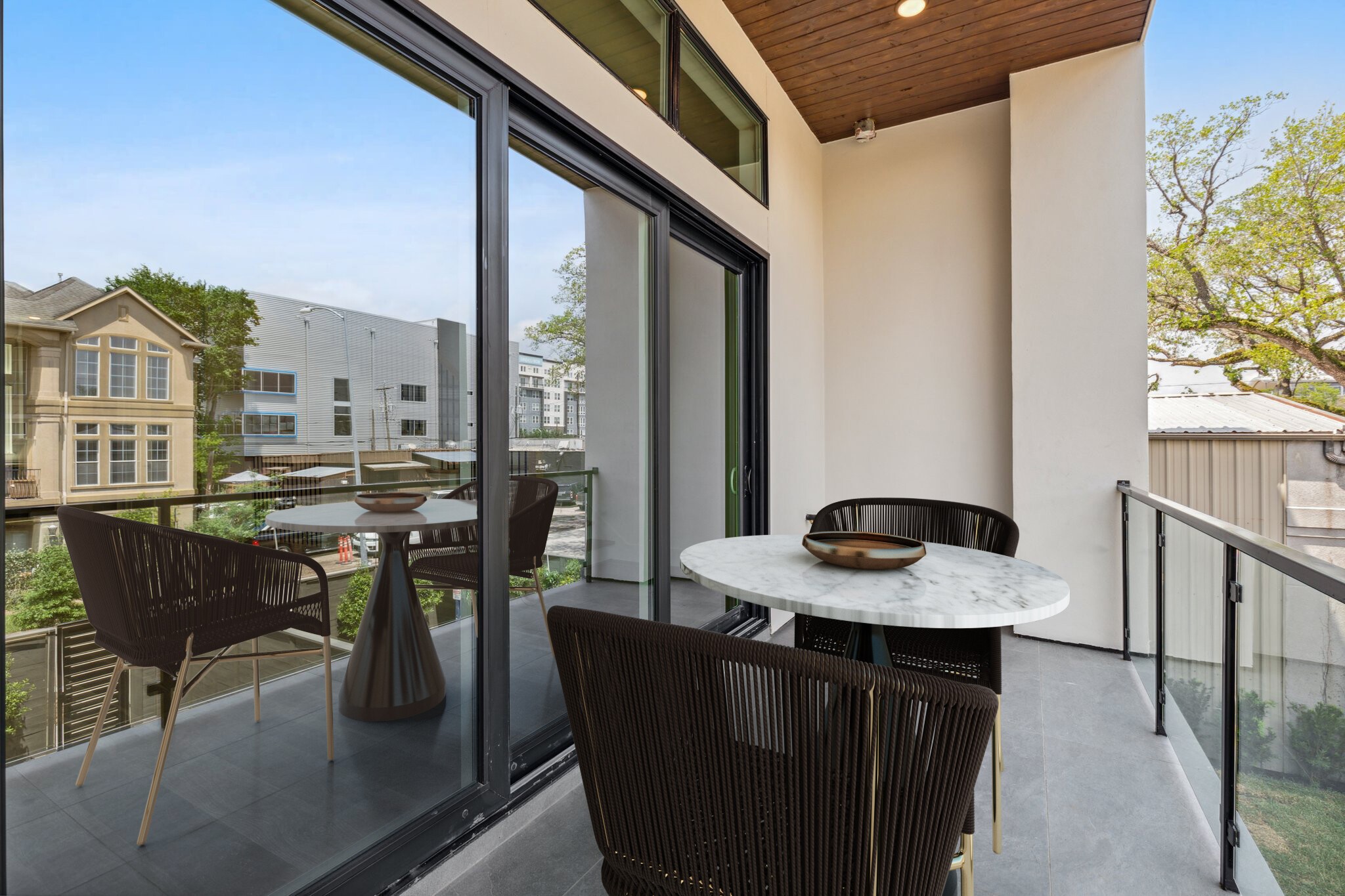 Another view of this fabulous outdoor 2nd floor balcony space. Perfect place to enjoy a glass of wine or cup of coffee & get some fresh air, right off of the main living room. Note this photo has been virtually staged.