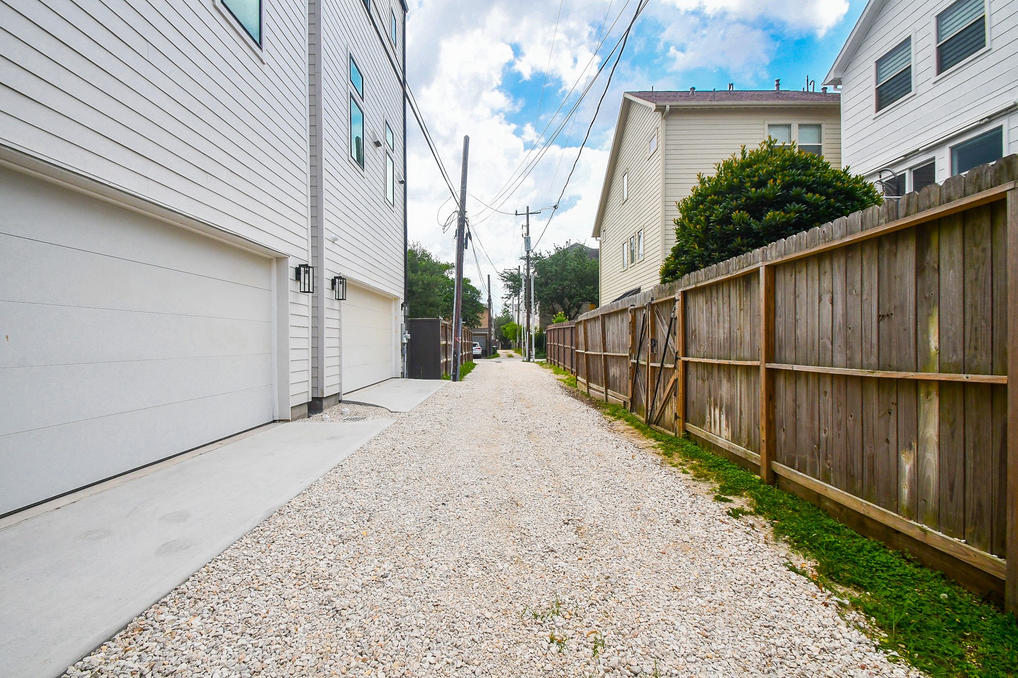 Alley access leads to your two car attached garage. Offers room for bigger vehicles to access with added gravel!
