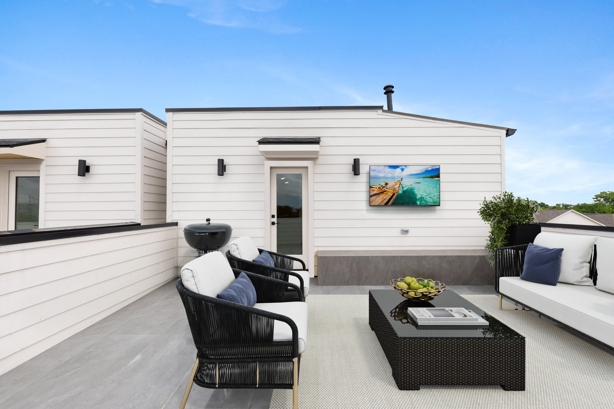Another angle of this incredible rooftop deck  TV wiring, and a built-in bench seat. Note: this photo has been virtually staged.