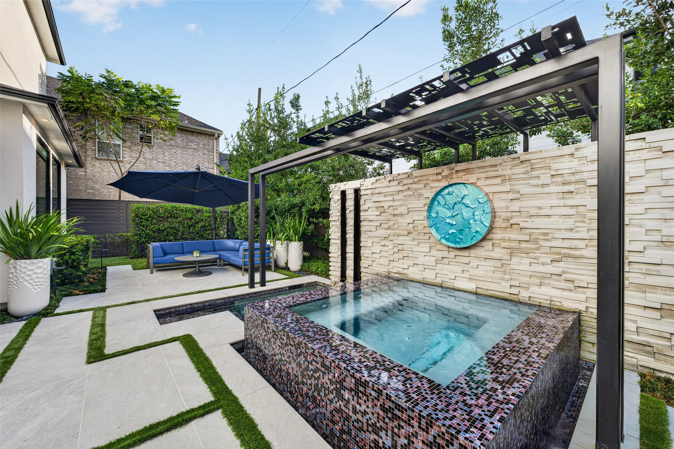 The backyard is a private resort collaboratively designed and executed by Laura Thompson, ASID and Blair Mitchner of Up Country Landscape Design.