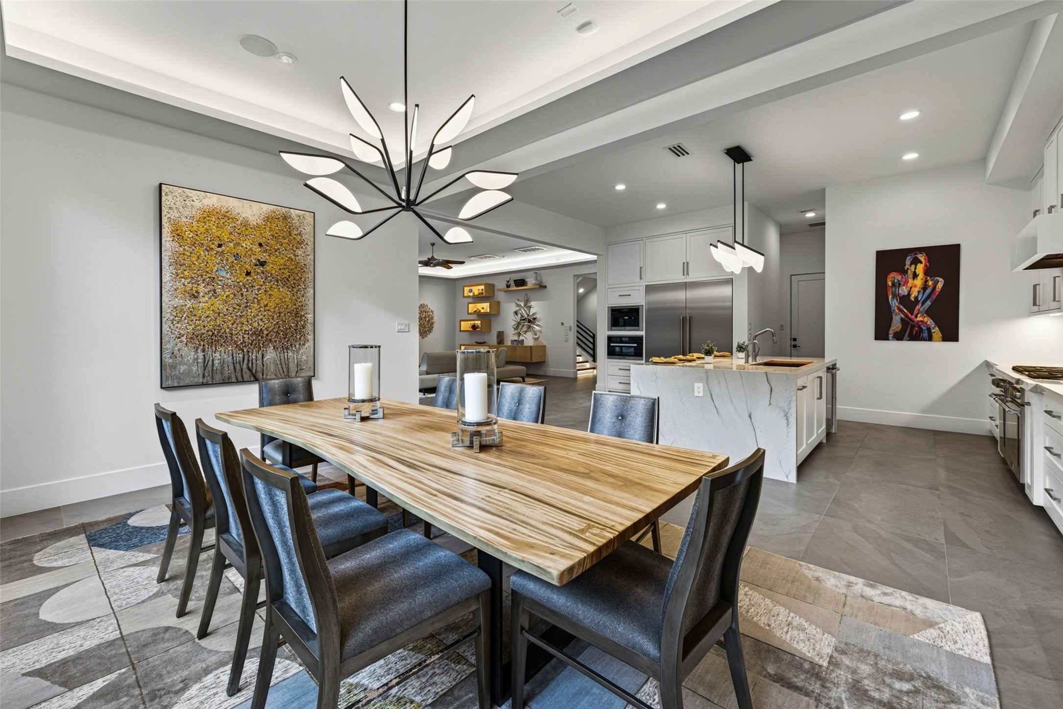 Although the entertaining areas are open to one another, each room has a distinct space bringing warmth to the well throughout floor plan.