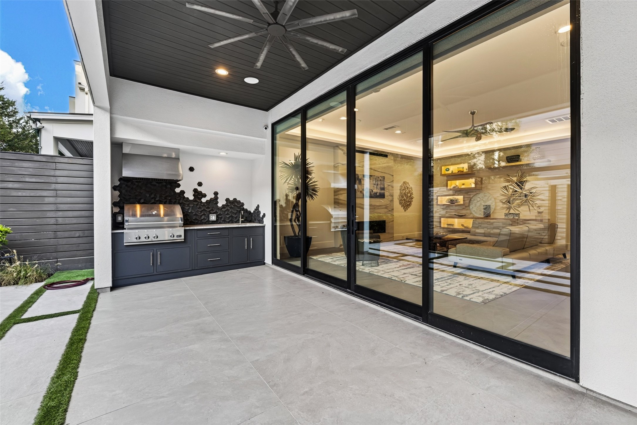 Escape outside to the large covered back patio or extend the living space by opening the Western Architectural Openings sliding-door system.