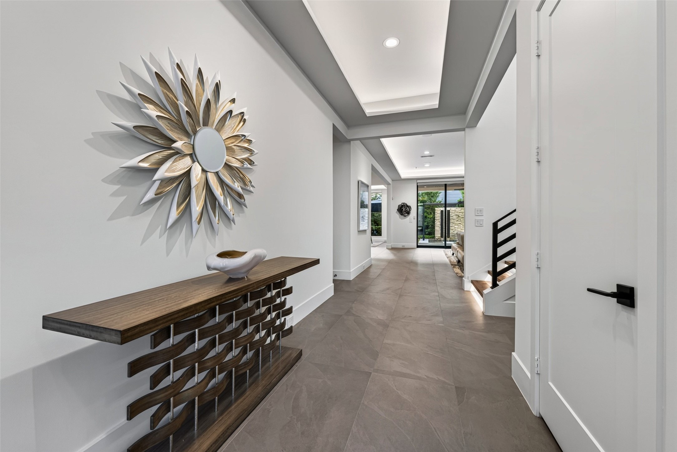 Greet guests in the wide foyer. The door to the right is an elevator ready closet. Greet guests in the wide foyer. The door to the right is an elevator ready closet.