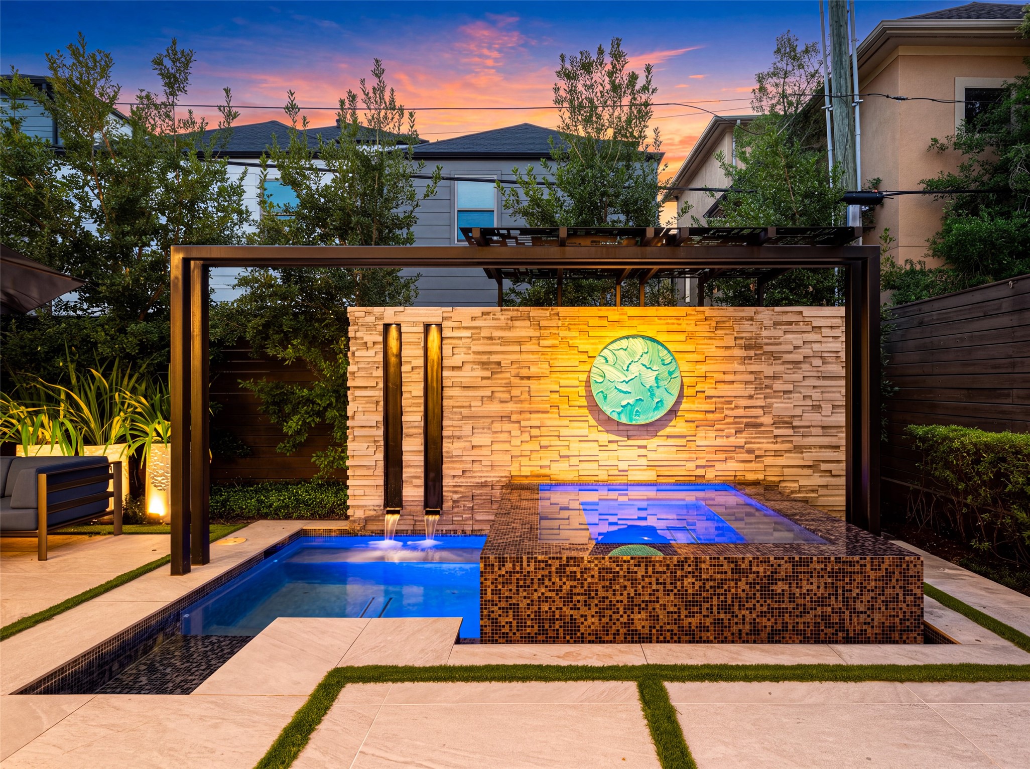 This twilight oasis is the perfect place for relaxing in the evening. Whether taking a cool dip, relaxing in the spa, or entertaining friends; this backyard delivers.