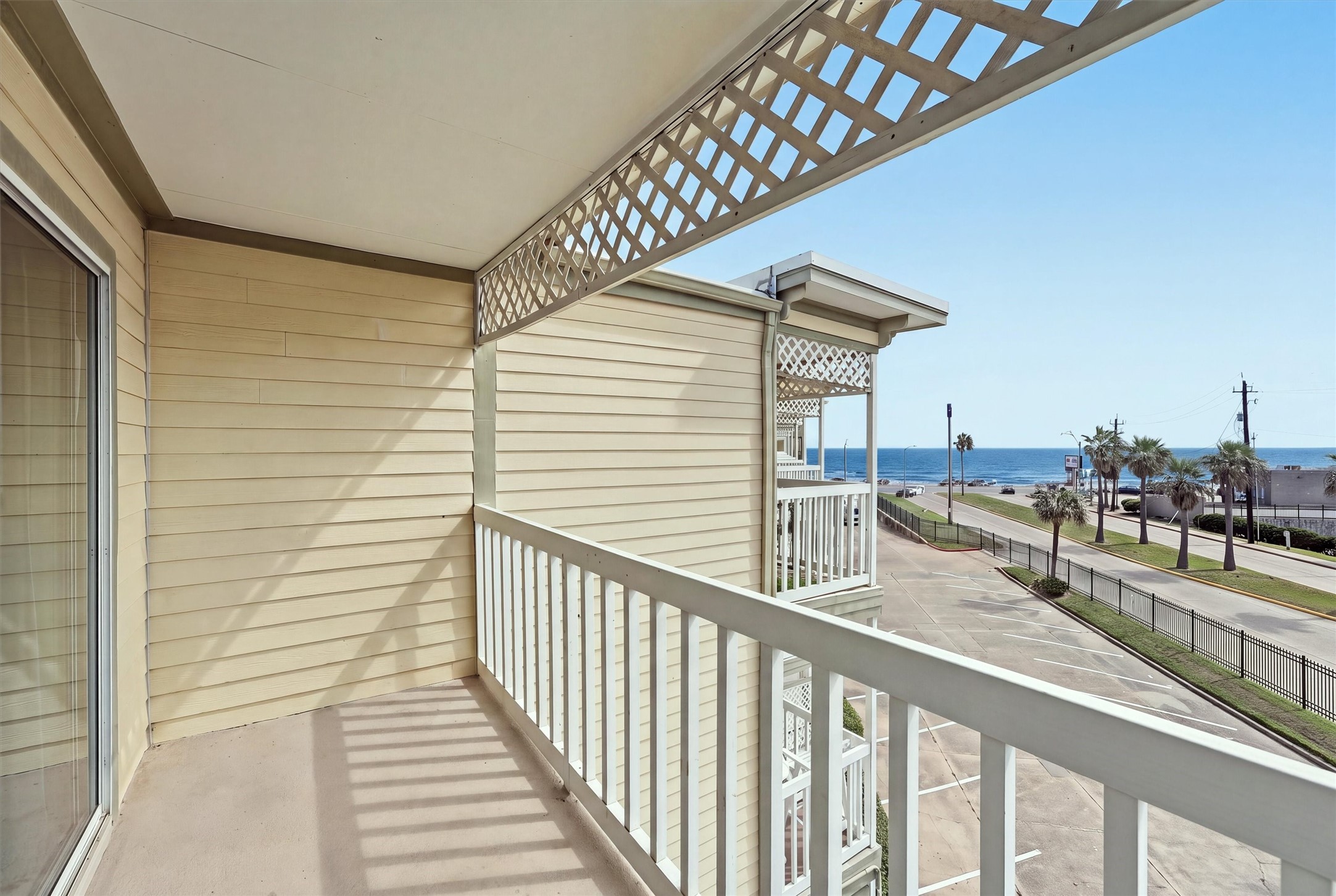 Private balcony overlooking Seawall Boulevard and the Gulf