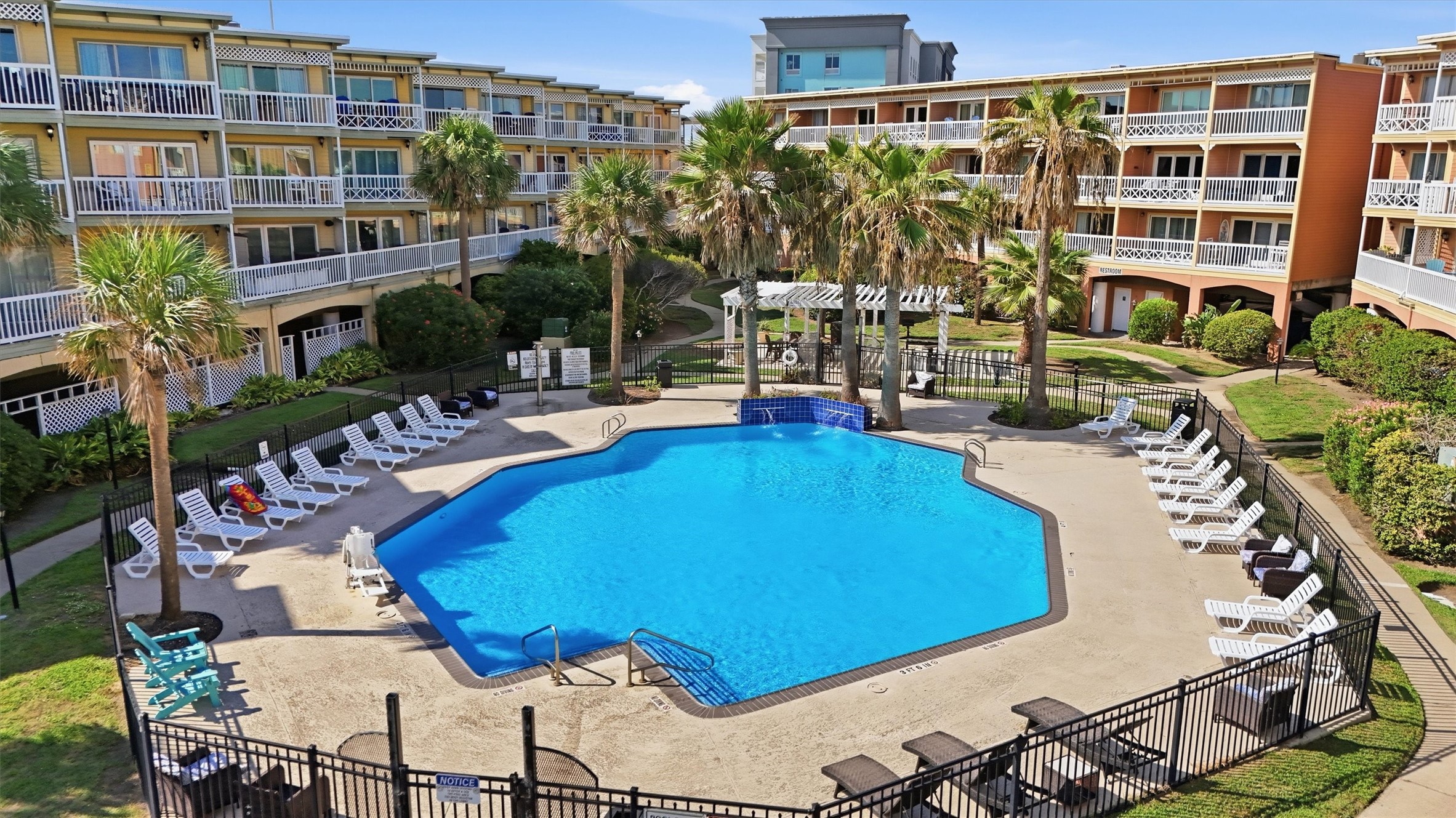 Pool courtyard framed by the community's buildings