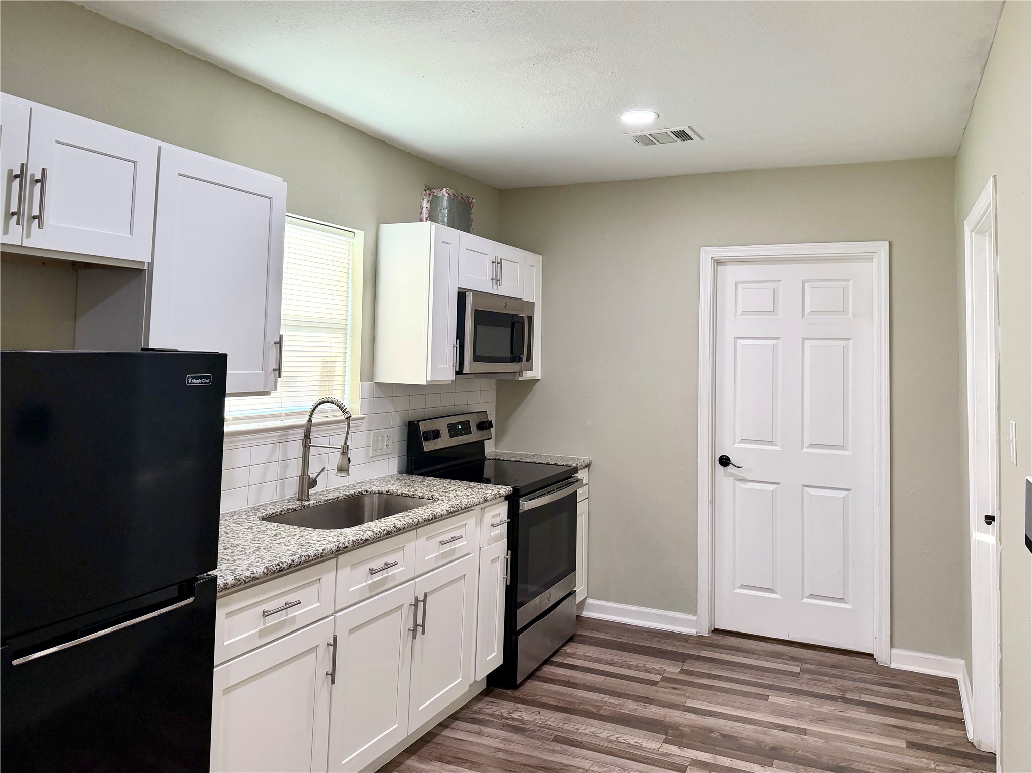 Kitchen with refrigerator. Kitchen with refrigerator.
