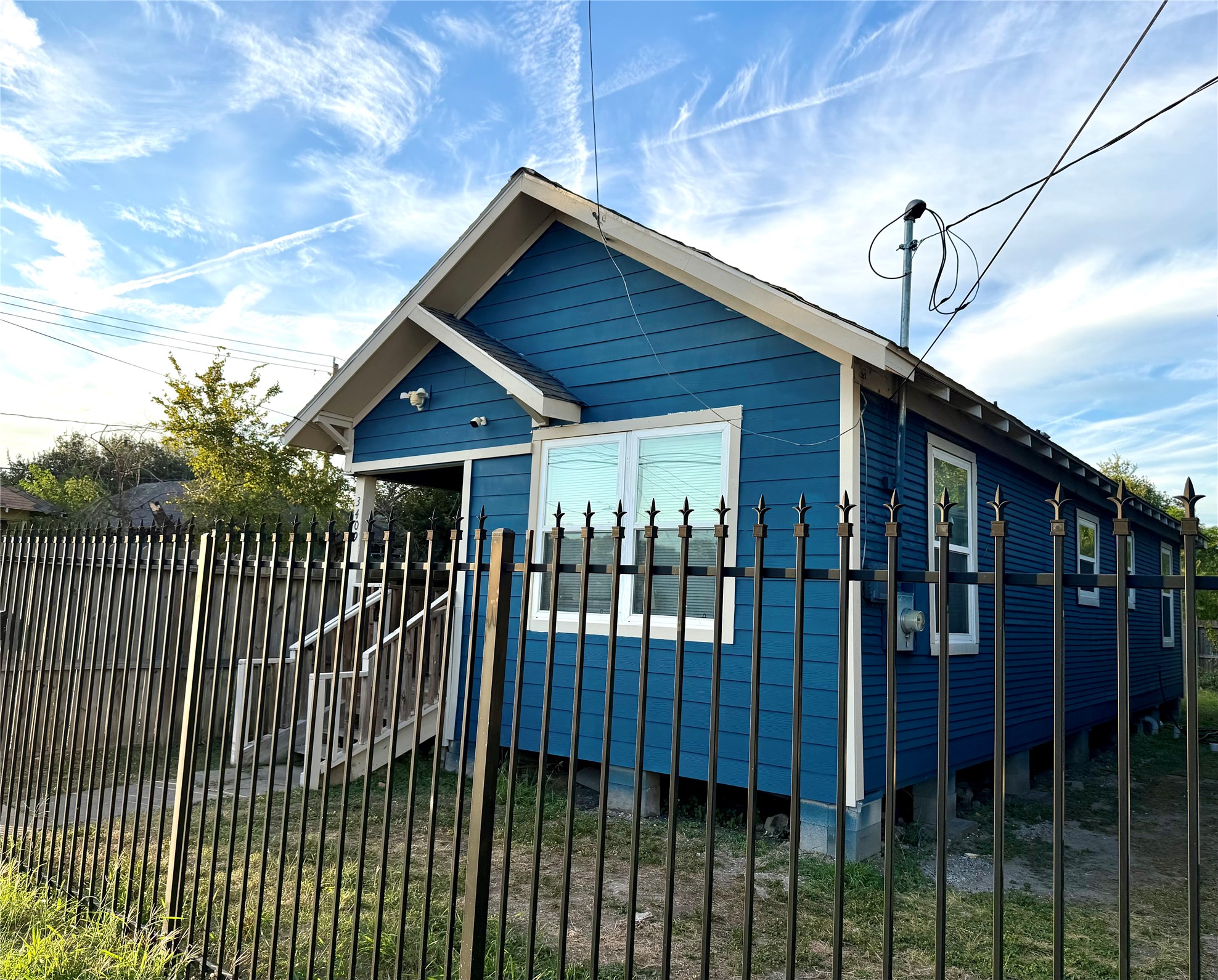 New exterior painting with some updated siding and windows.