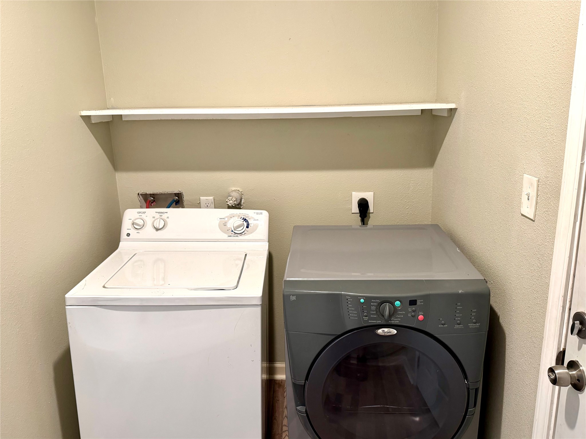 Laundry room with full size washer and dryer.