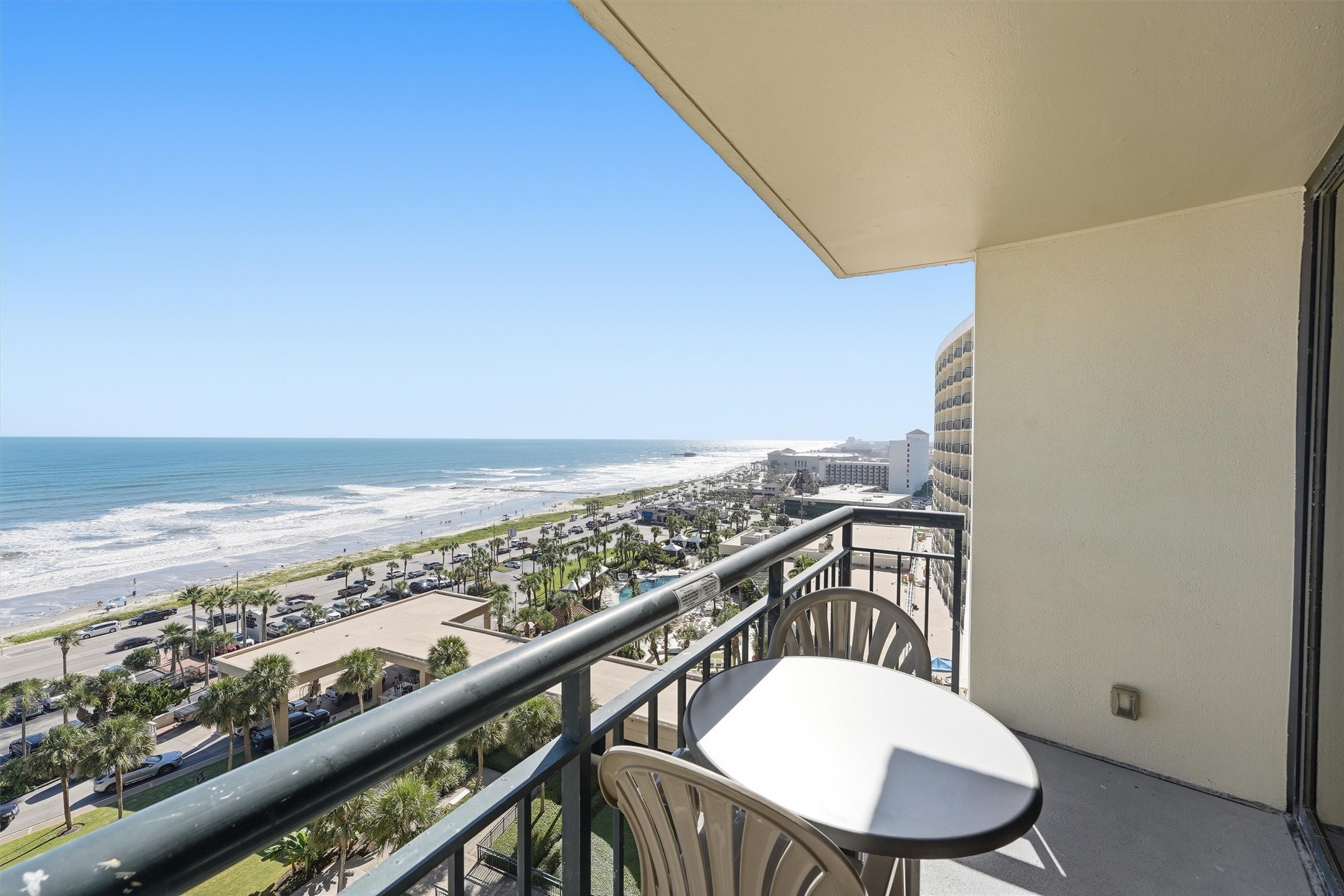 Enjoy an elevated perspective of the Gulf, Seawall, and beautifully landscaped resort grounds.