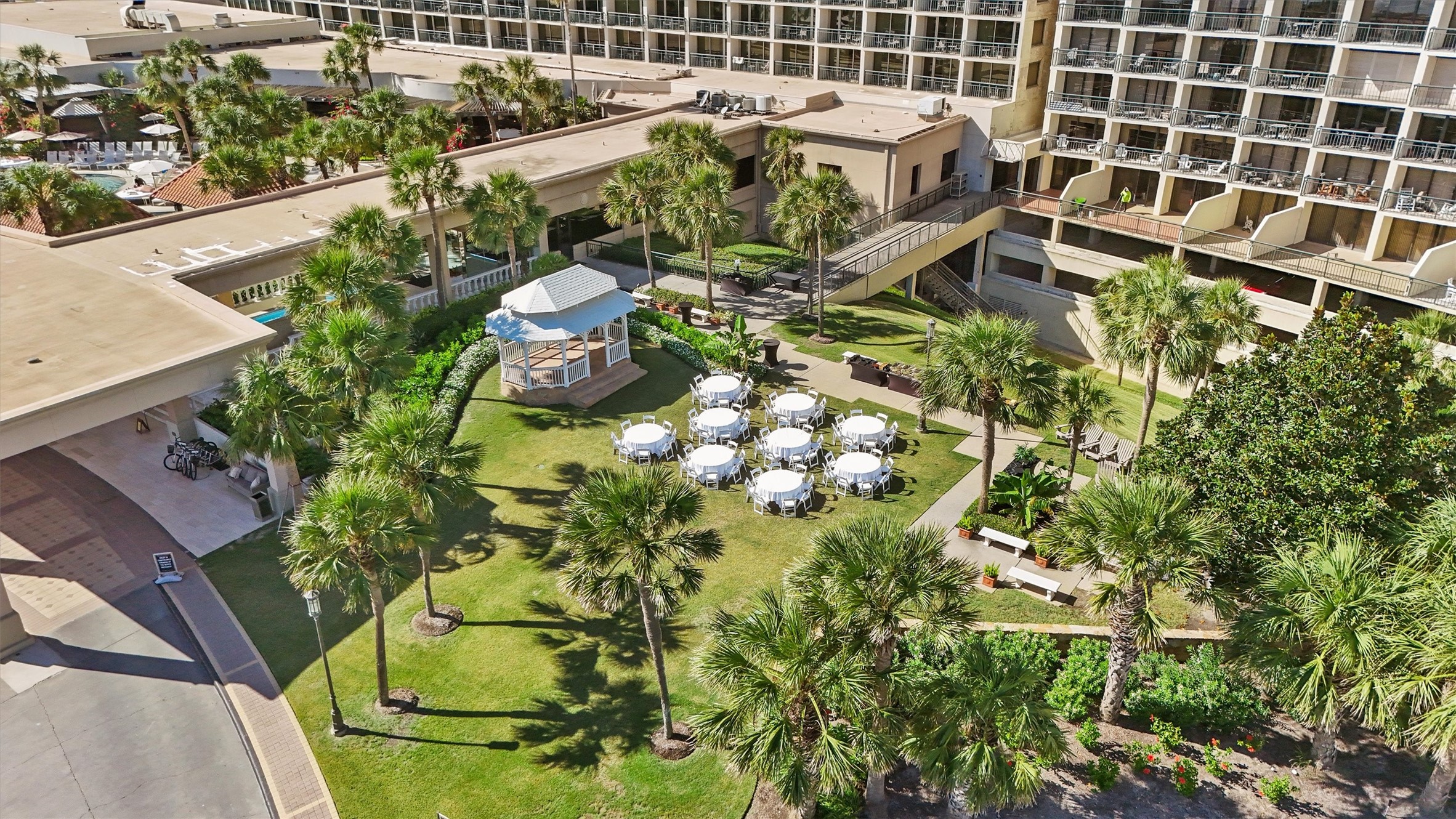 A charming gazebo anchors the landscaped grounds, offering a beautiful setting for gatherings, special events, and relaxed outdoor moments within the resort.