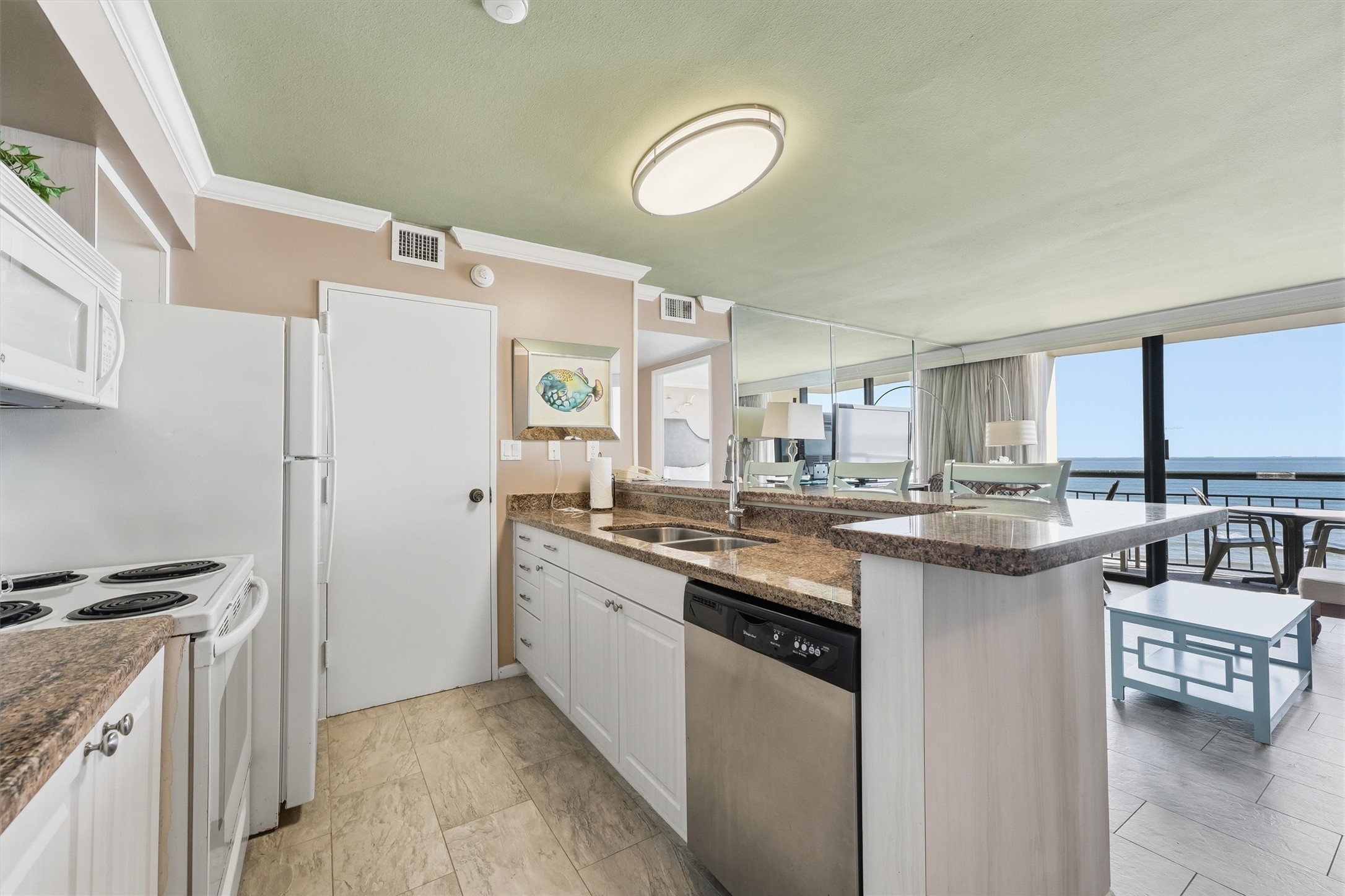 Prepare your favorite meals while enjoying an open view into the living area and out toward the Gulf.