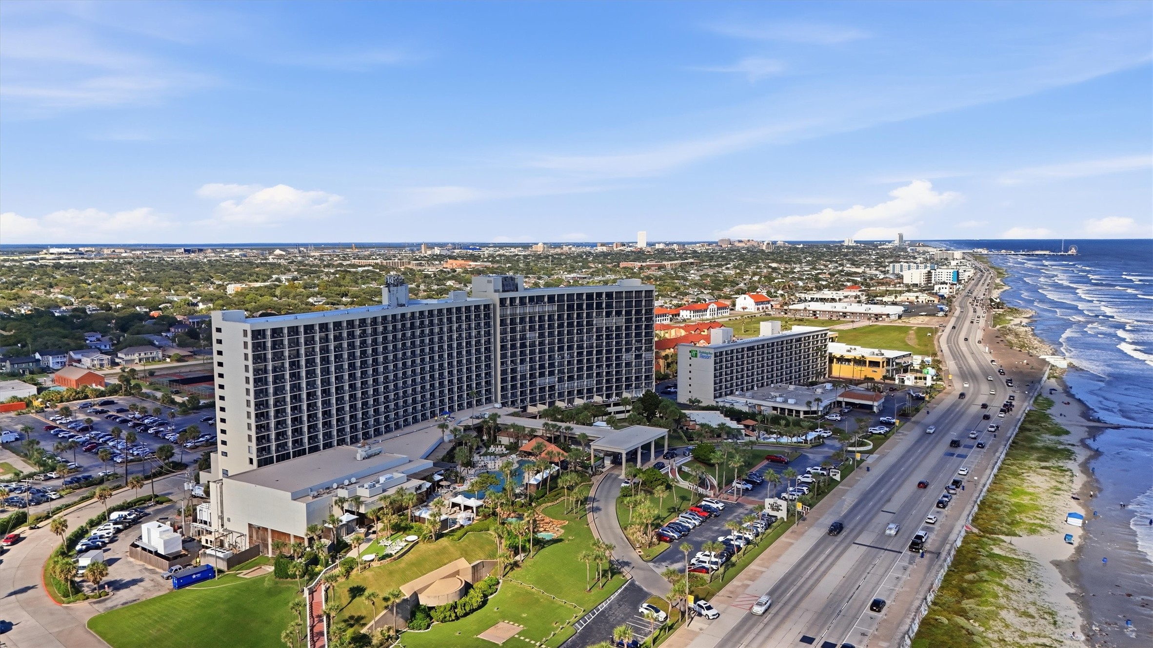 This aerial perspective highlights the resort grounds and their beautiful setting along Galvestons coastline.