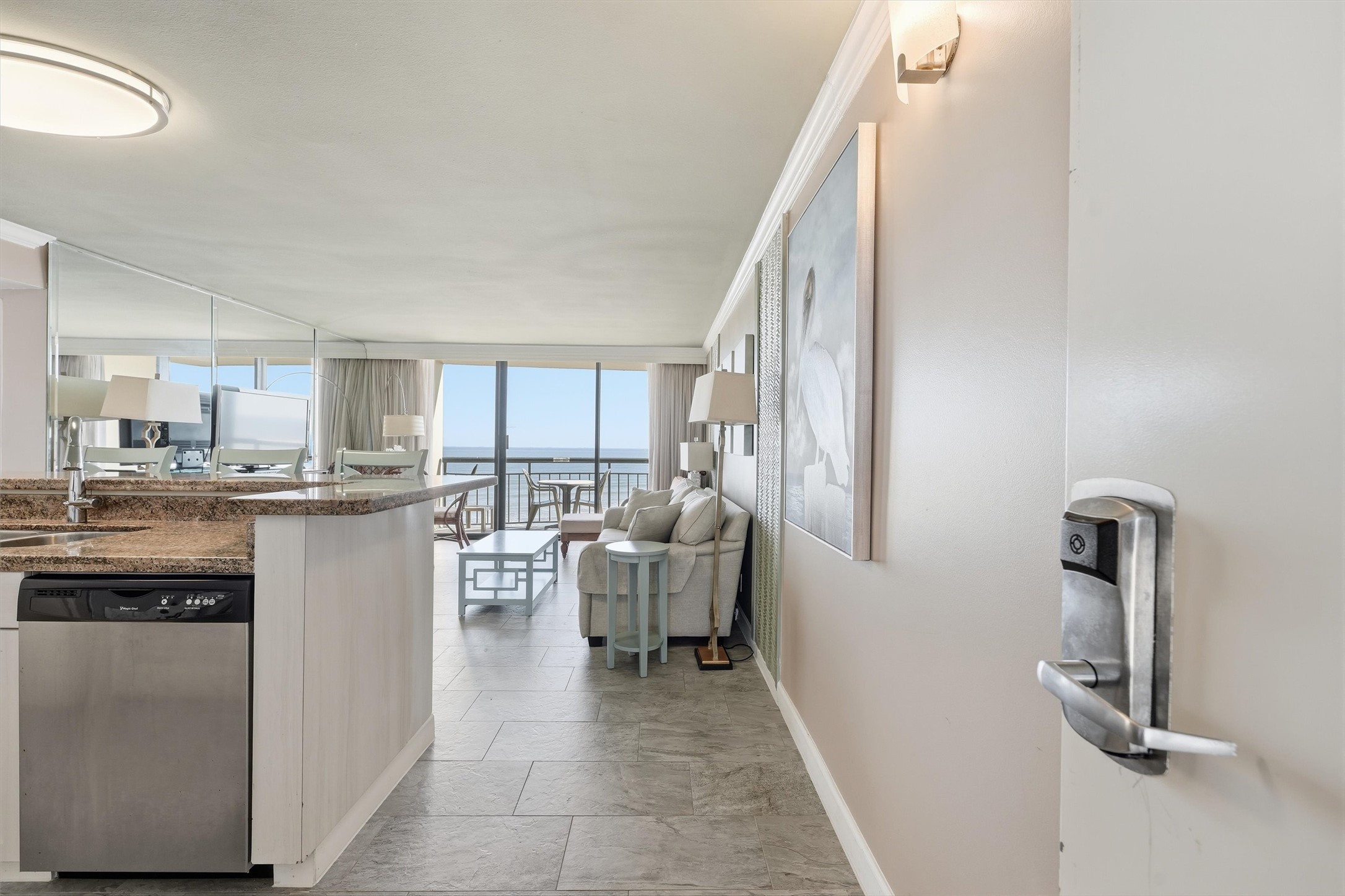 A welcoming entry opens to a bright coastal retreat with beautiful Gulf views straight ahead.