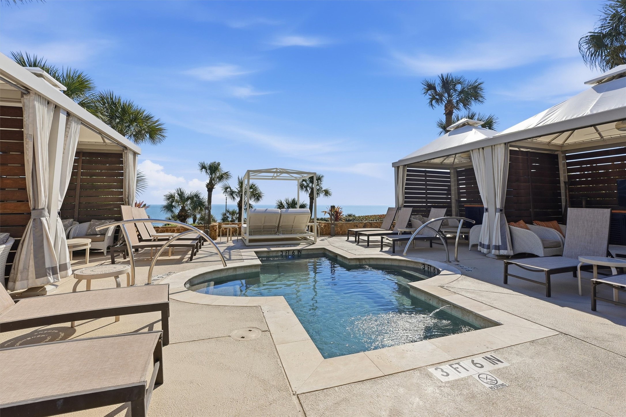 The resort pool experience is designed for leisure, featuring ample seating, shaded areas, and a welcoming environment for residents and guests alike.