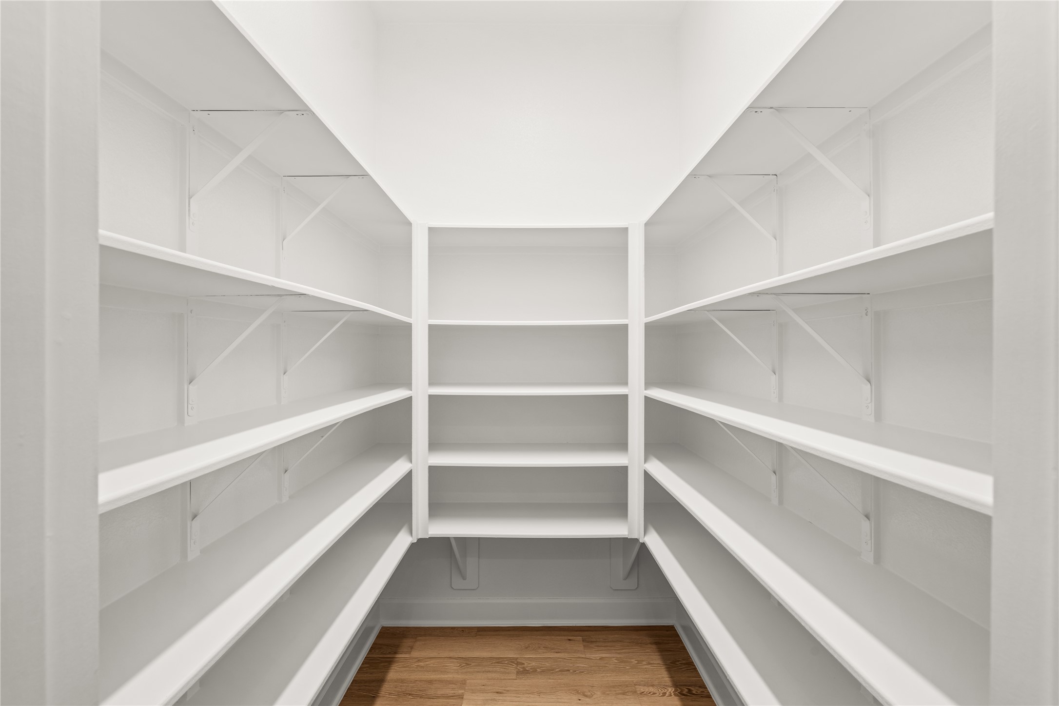 Spacious walk-in pantry with ample shelving for organized storage. Create your Pinterest worthy pantry space.