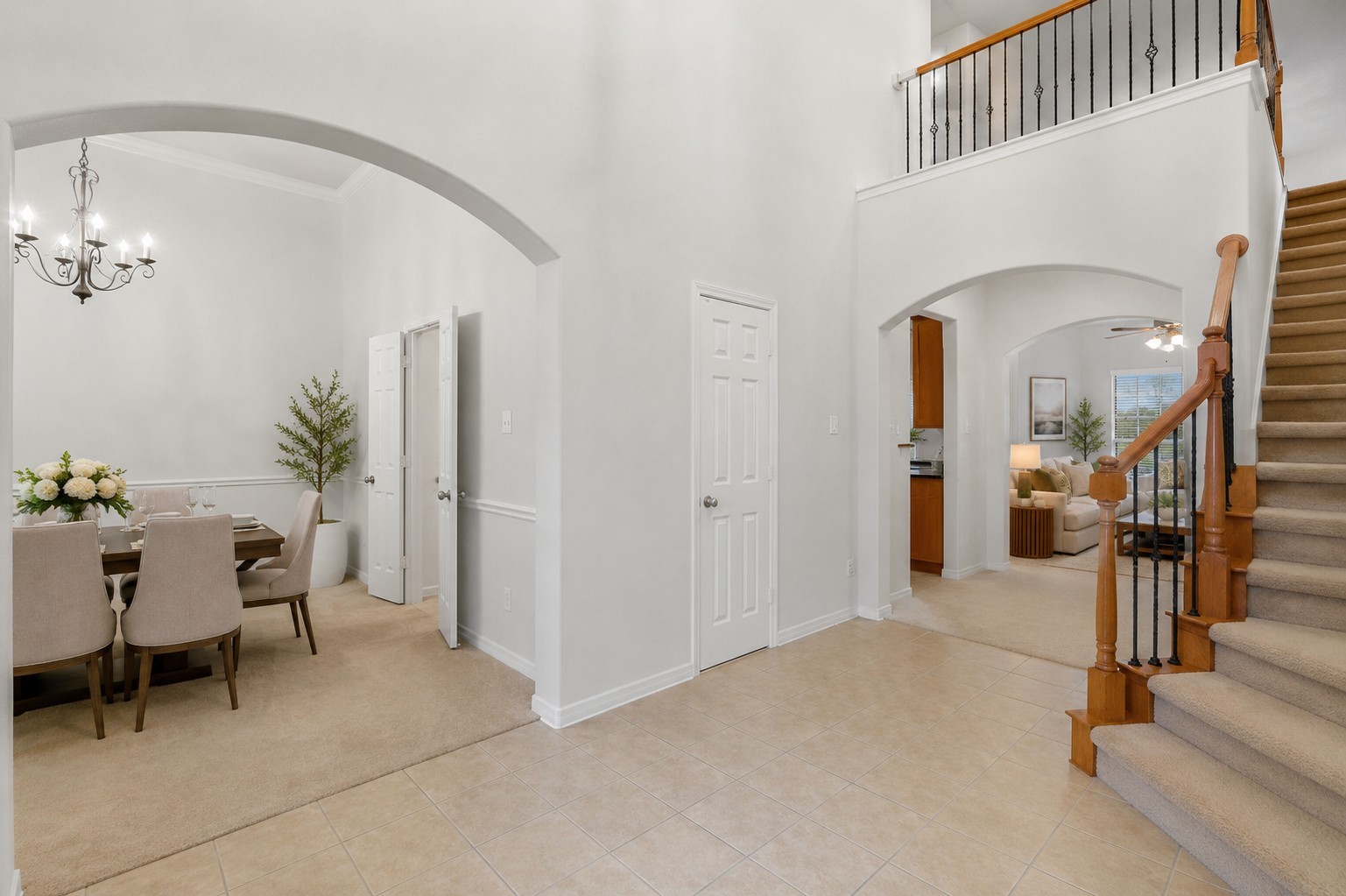 A bright, open foyer provides seamless access to the formal dining area, staircase, kitchen, and adjoining living spaces.**Virtually staged
