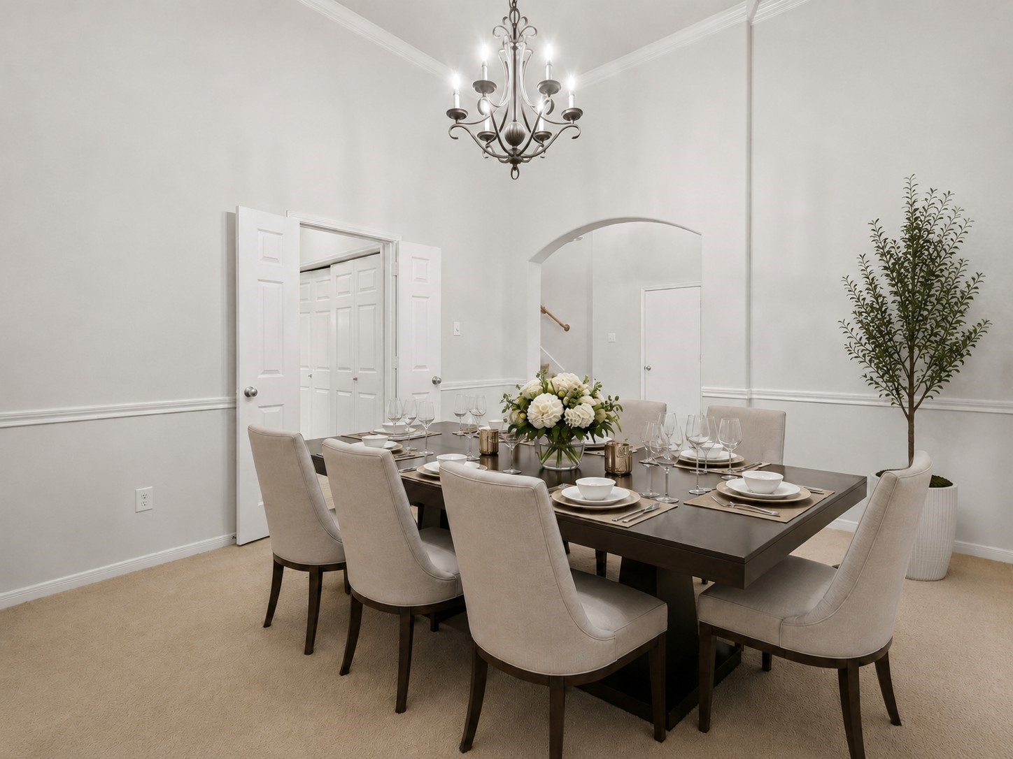 Another view of the formal dining room highlights its generous proportions, high ceiling, decorative molding, and easy connection to the foyer.**Virtually staged